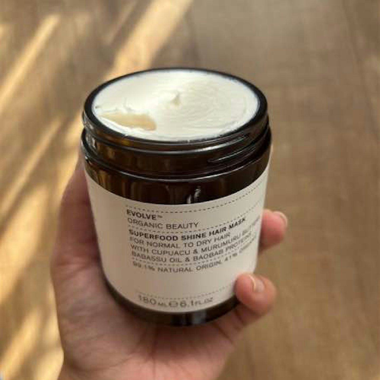 Evolve hair mask, white cream inside brown jar