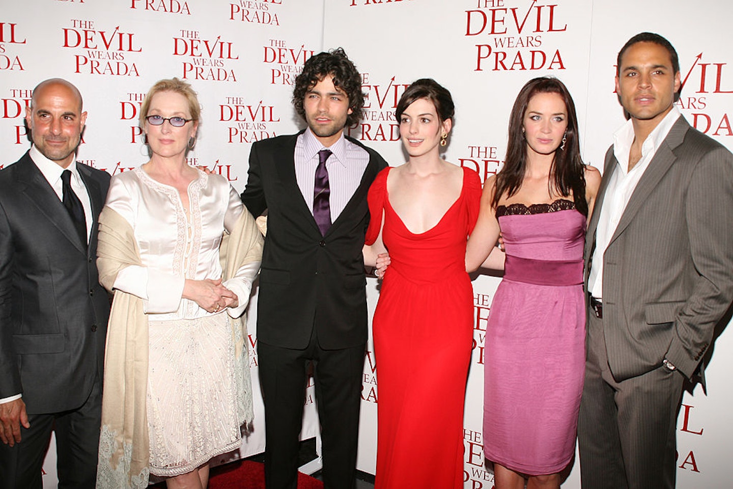 The original cast of The Devil Wears Prada attends the Twentieth Century Fox Premiere of the film in 2006 - Stanley Tucci, Meryl Streep, Adrian Grenier, Anne Hathaway, Emily Blunt and Daniel Sunjata (from left to right)