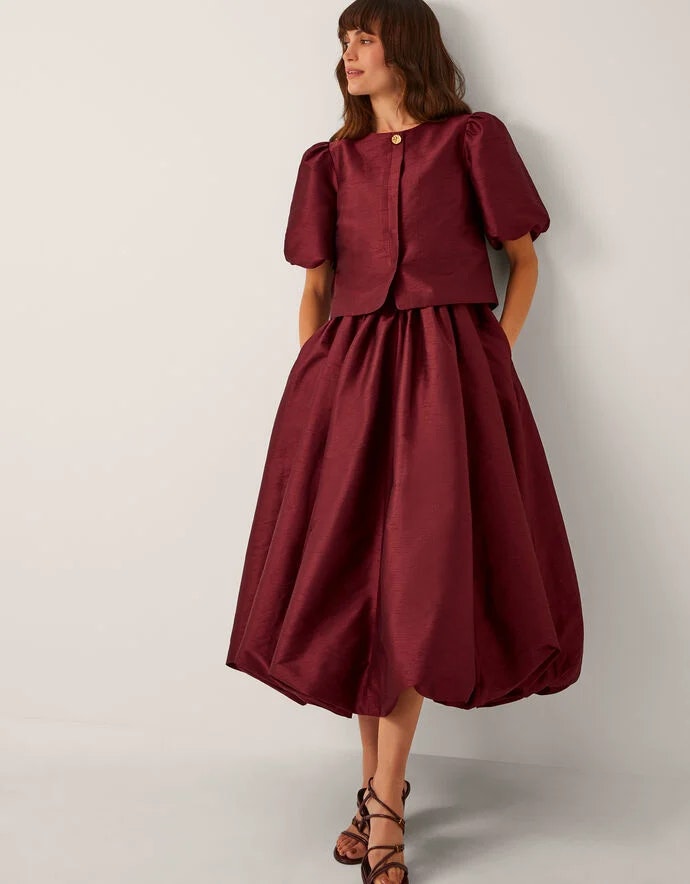 Woman wearing burgundy monsoon dress