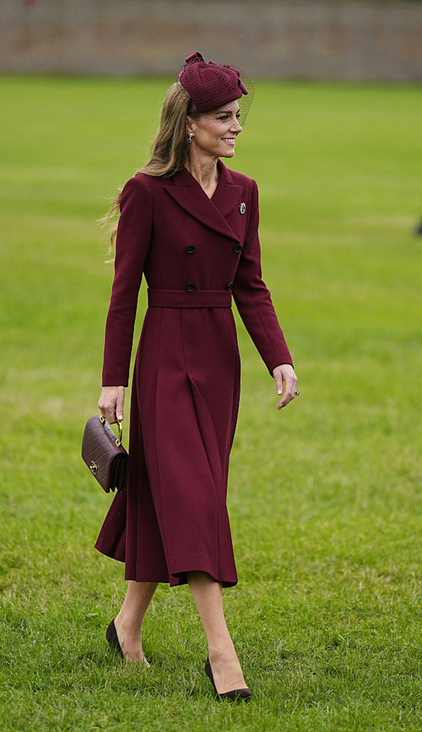 Britain's Catherine, Princess of Wales in a burgundy coat dress
