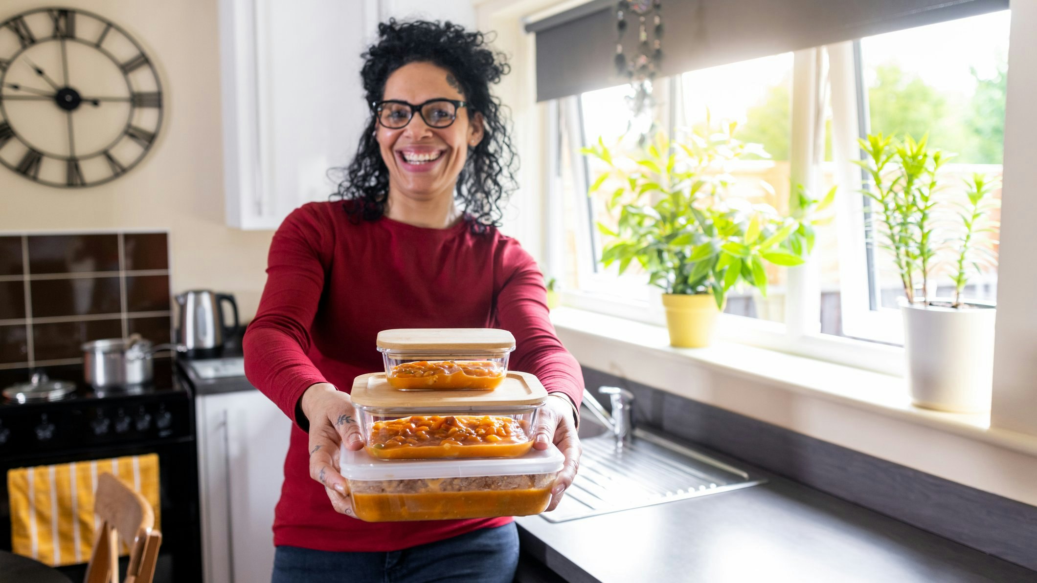 Batch cooking. Woman with meals ready for the freezer