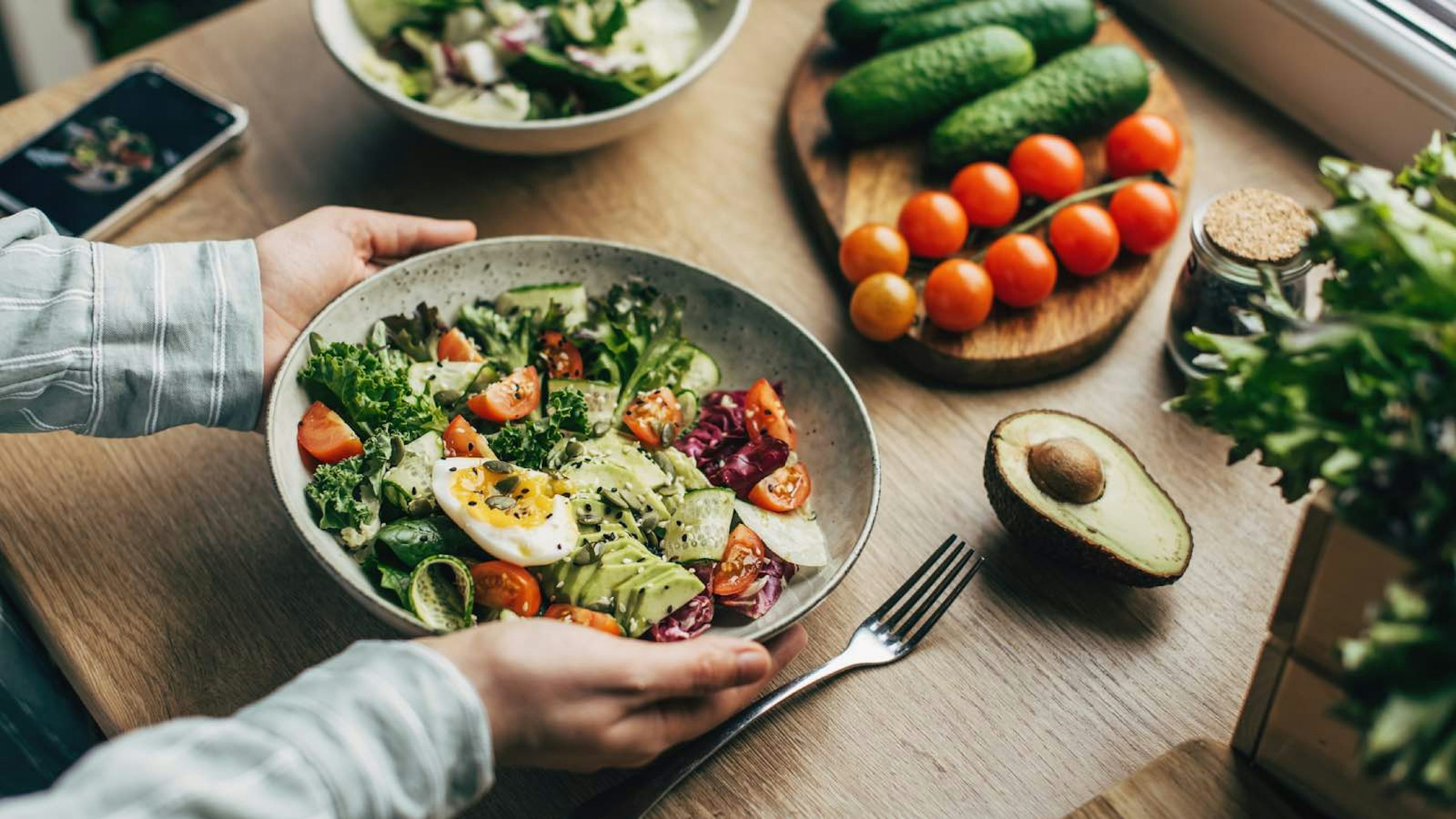 large salad with eggs and avocado