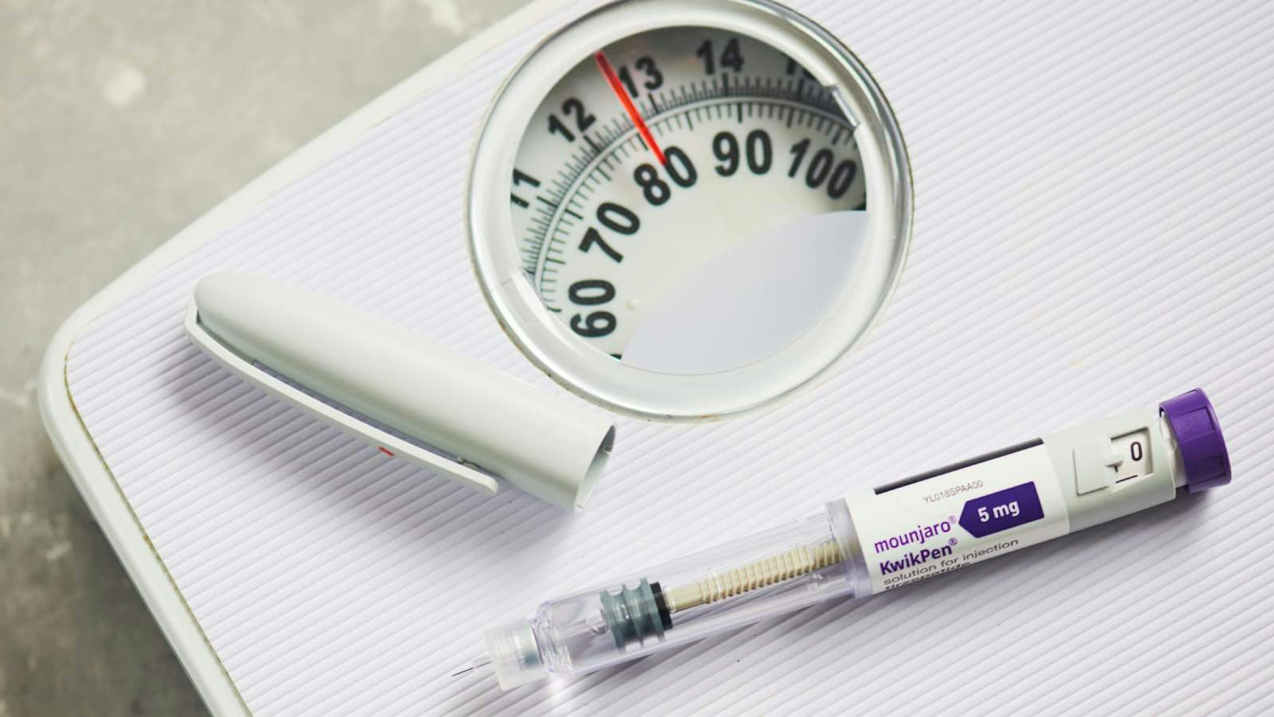 Weight loss injection, a pair of scales