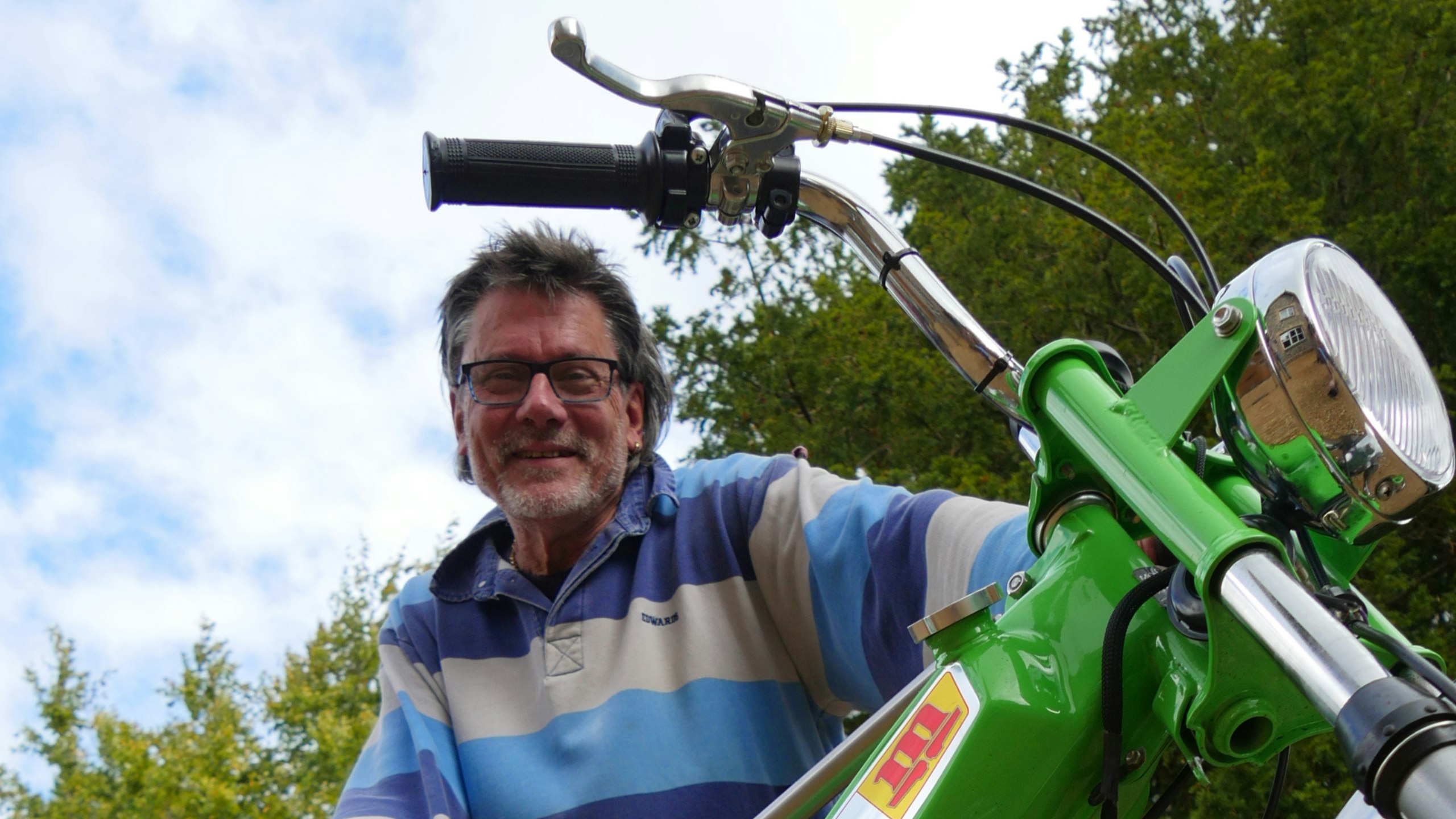 Bill Gysin with his crossbreed Mobylette and a Kawasaki S1