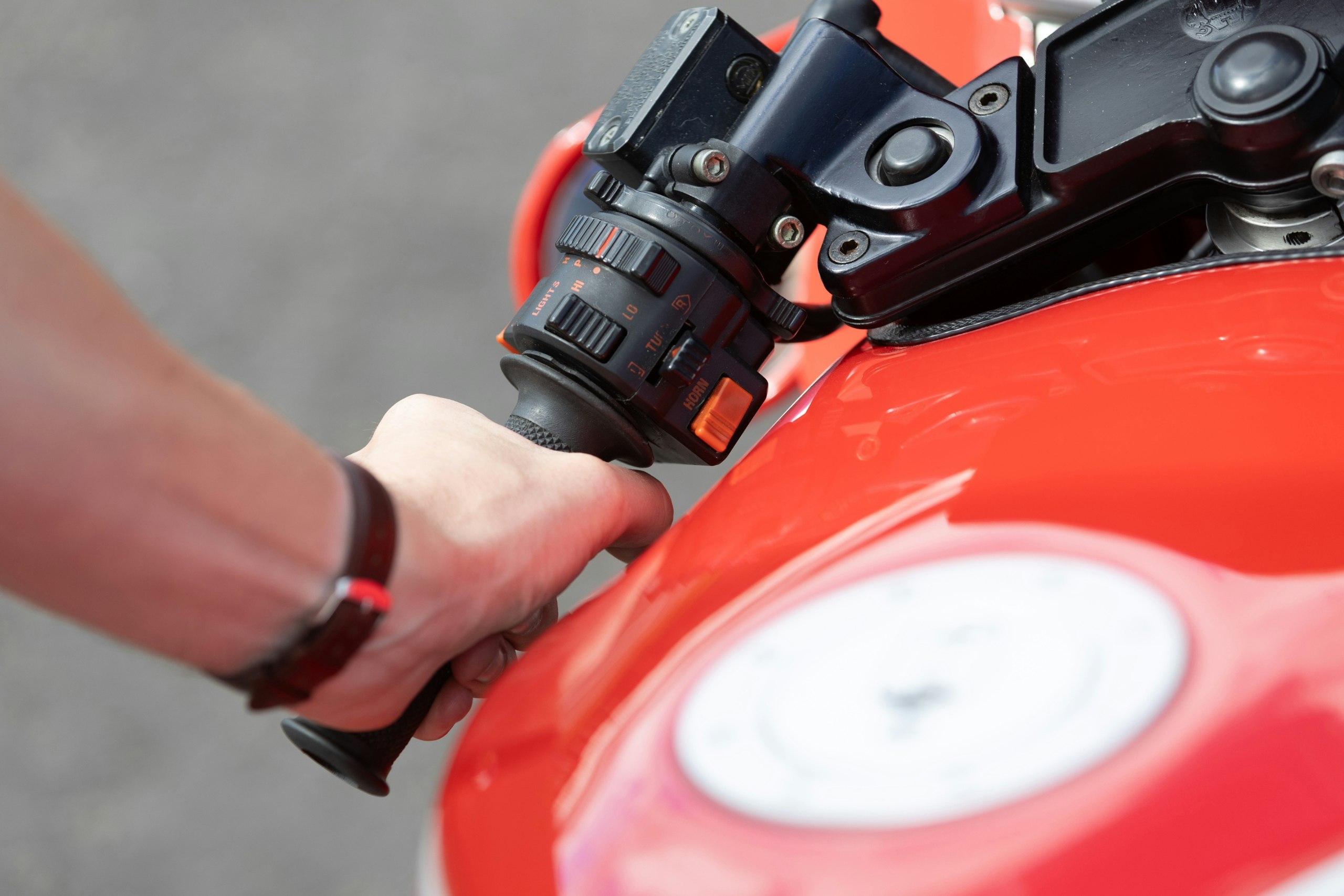A close up of the Ducati 906 Paso controls on the handlebar