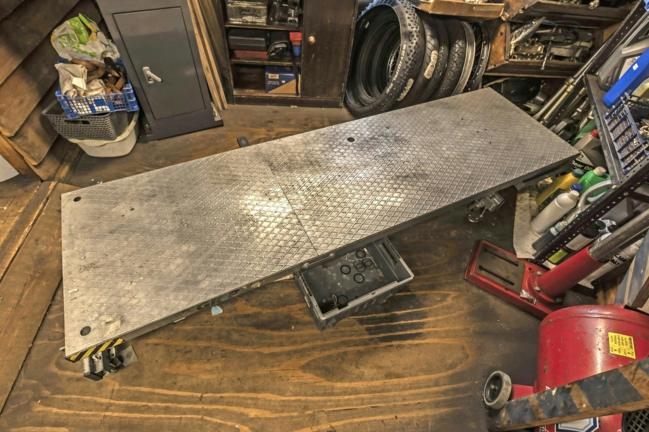 Motorcycle lift table inside a home workshop
