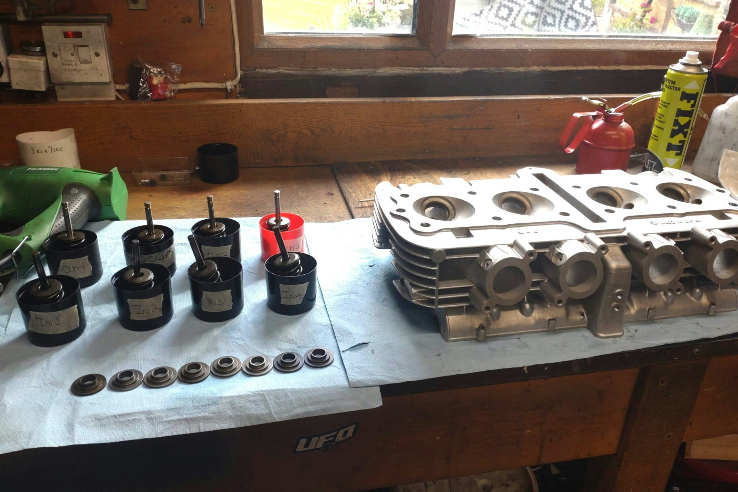Close-up of the Suzuki GS1000S cylinder head and engine components during rebuild