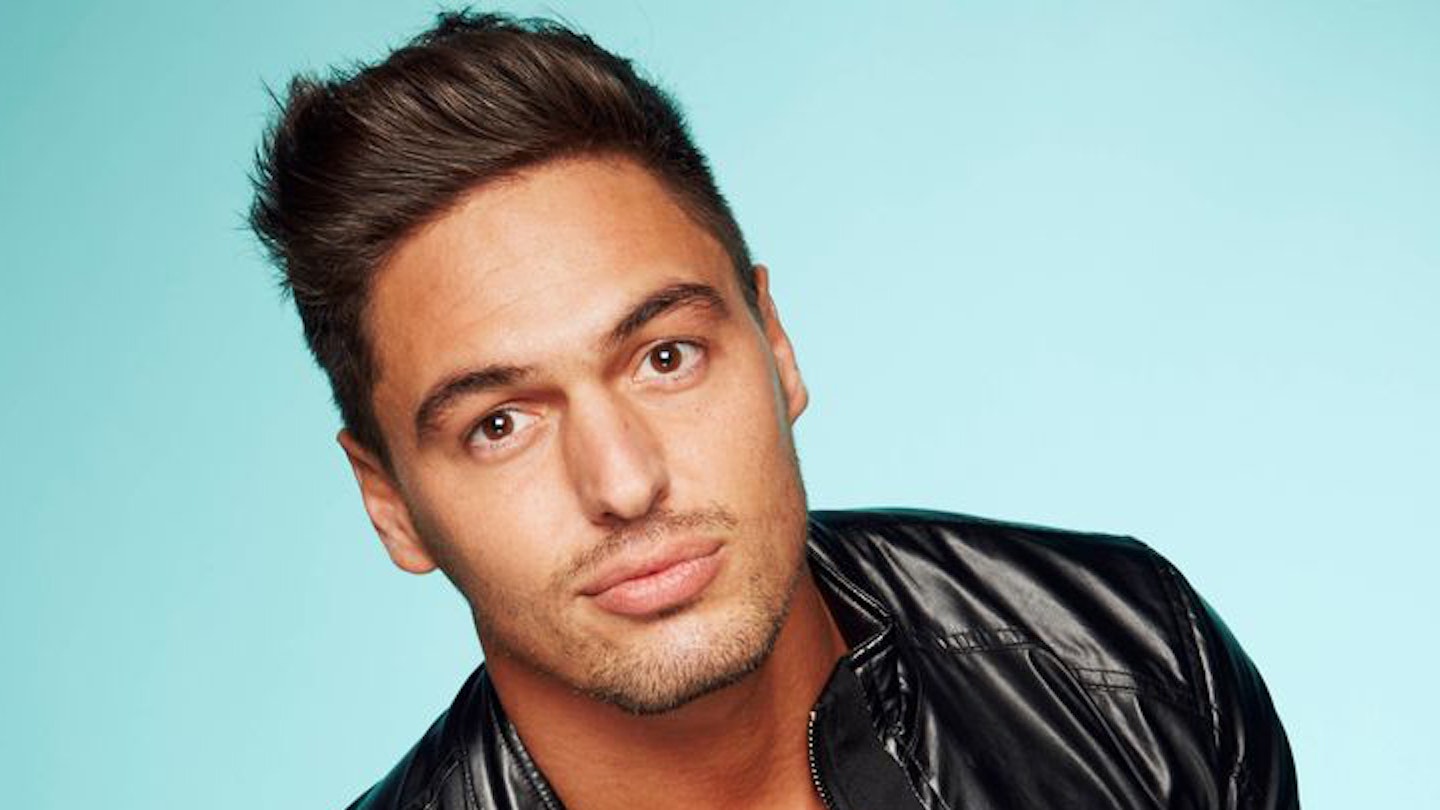 Mario Falcone looks at the camera wearing a leather jacket