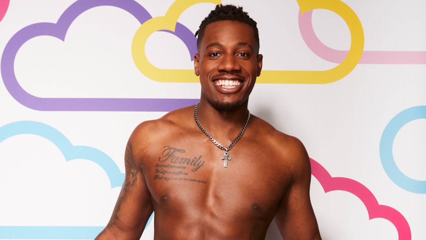 Love Island's Shaq Muhammad posing against a white background with multi-coloured clouds