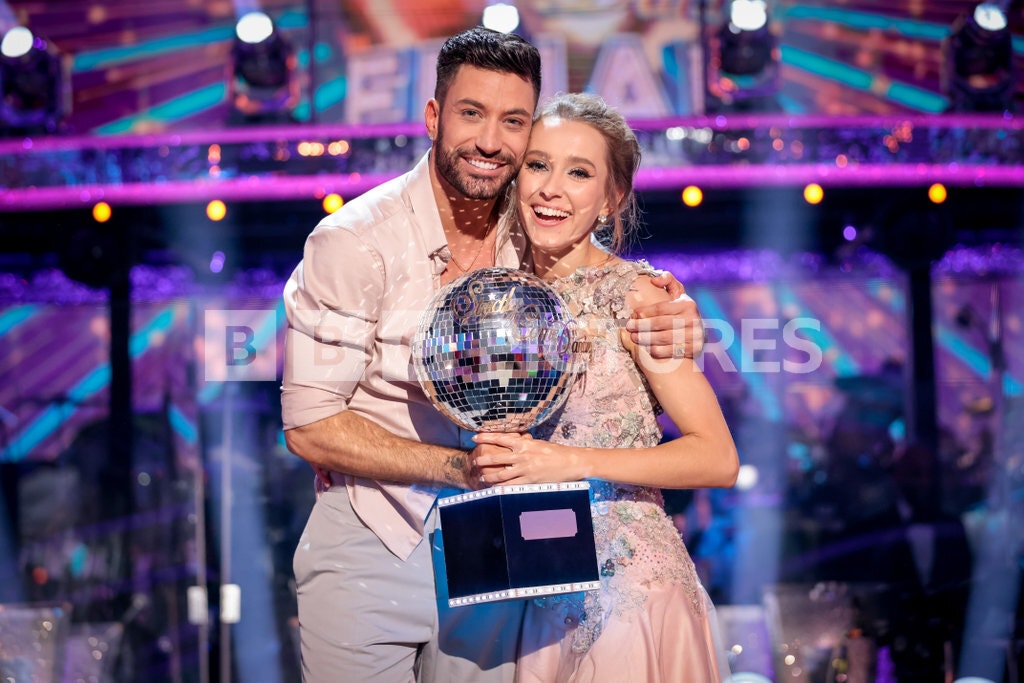 People: Giovanni Pernice and Rose Ayling-Ellis holding the Strictly trophy