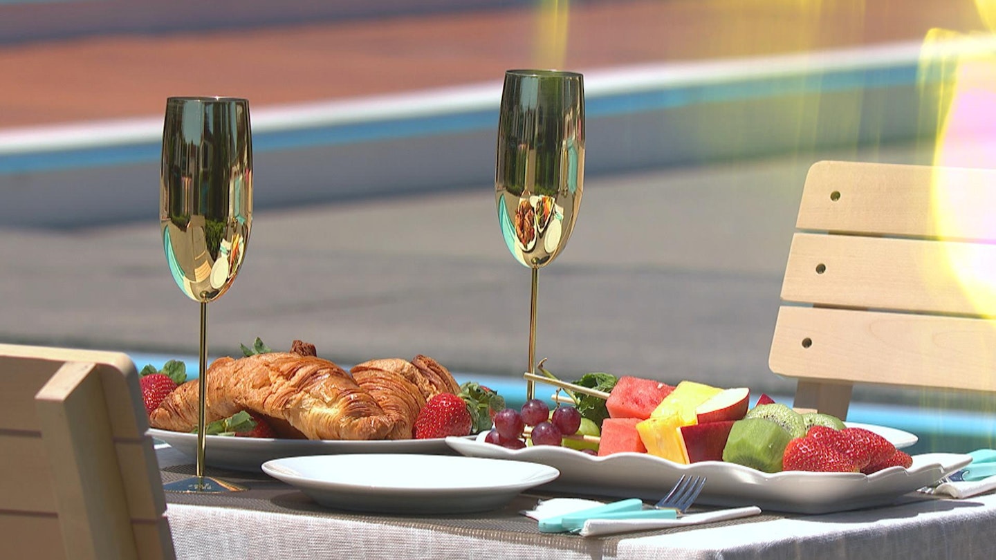 Love island date food - two champagne flutes and fruit