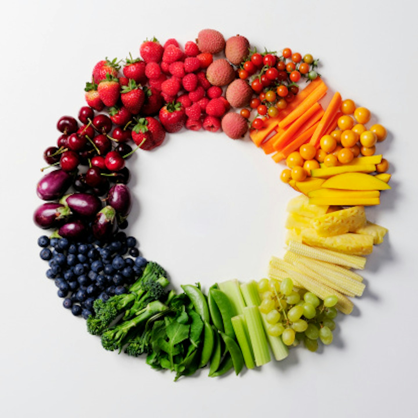 Rainbow of fruit and vegetables arranged in a circle