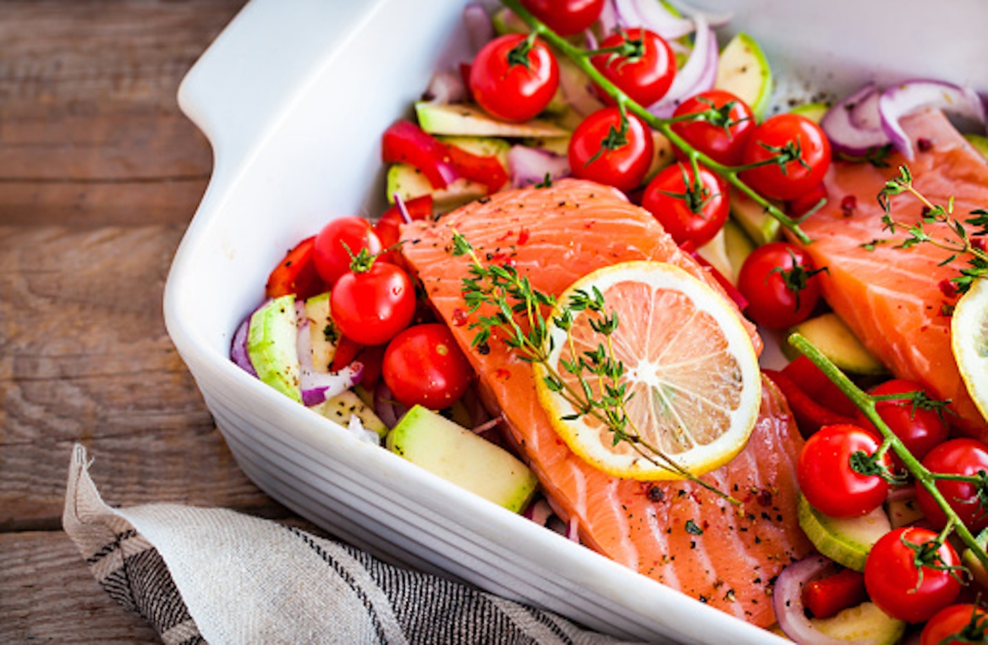 Salmon and vegetables in ovenproof dish