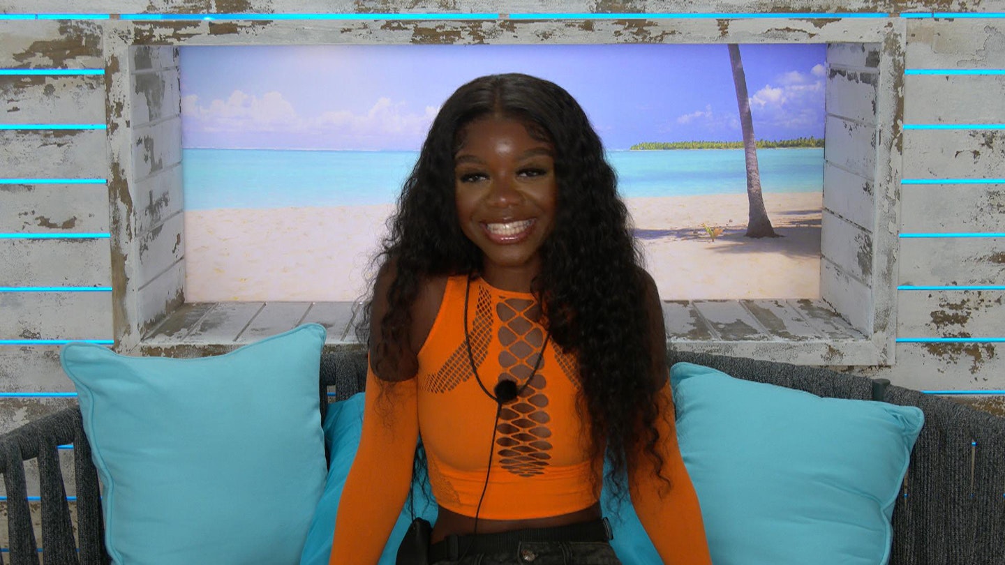 Tanya sitting in the Love Island Beach Hut