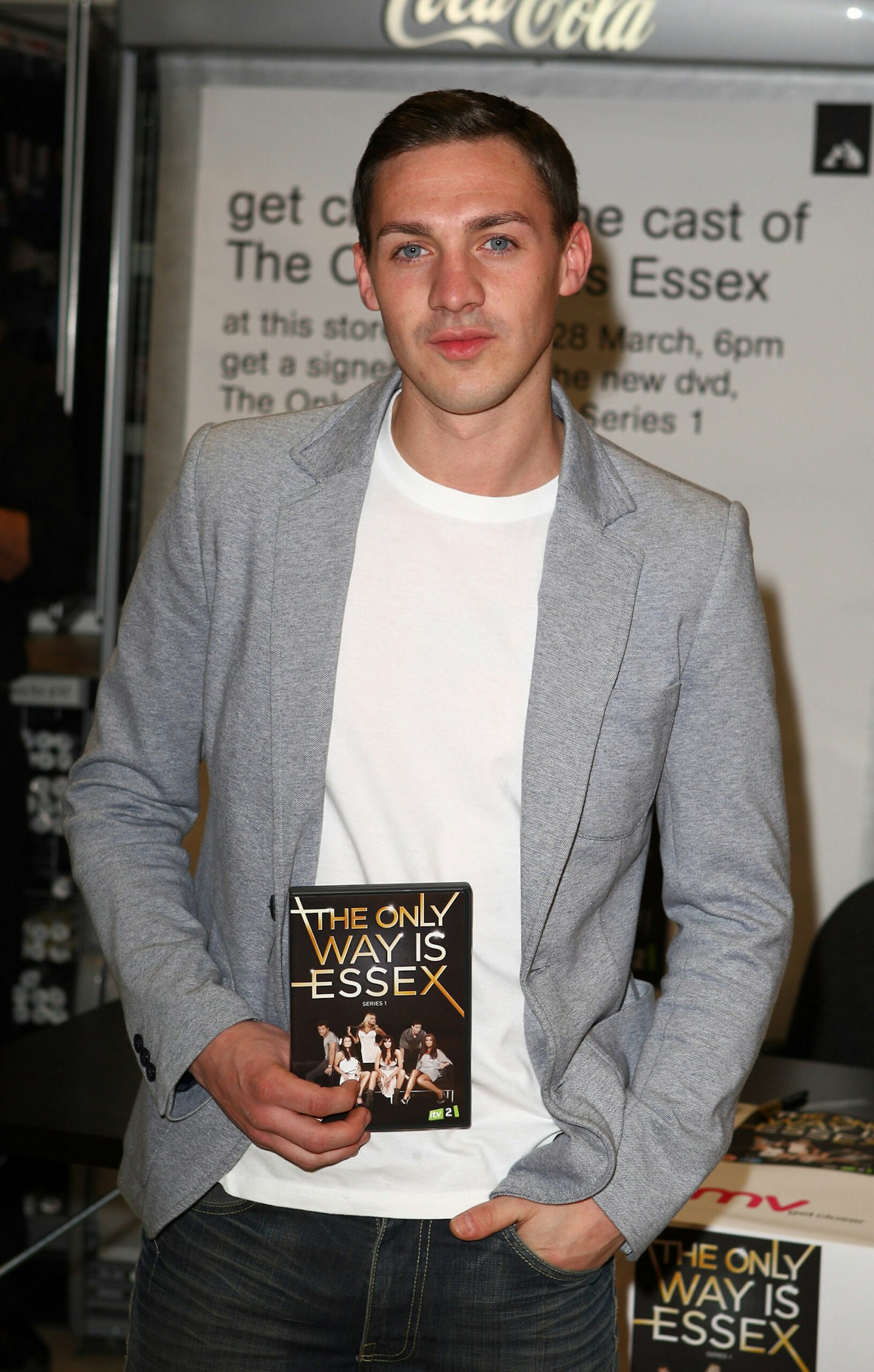 Kirk Norcross holding a TOWIE DVD