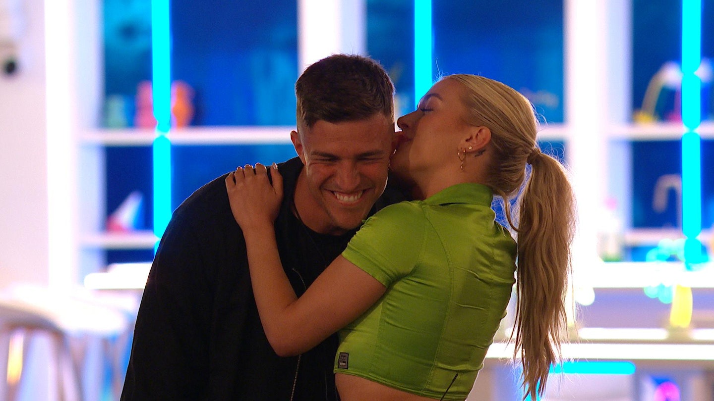 Molly nibbling on Mitchel's ear