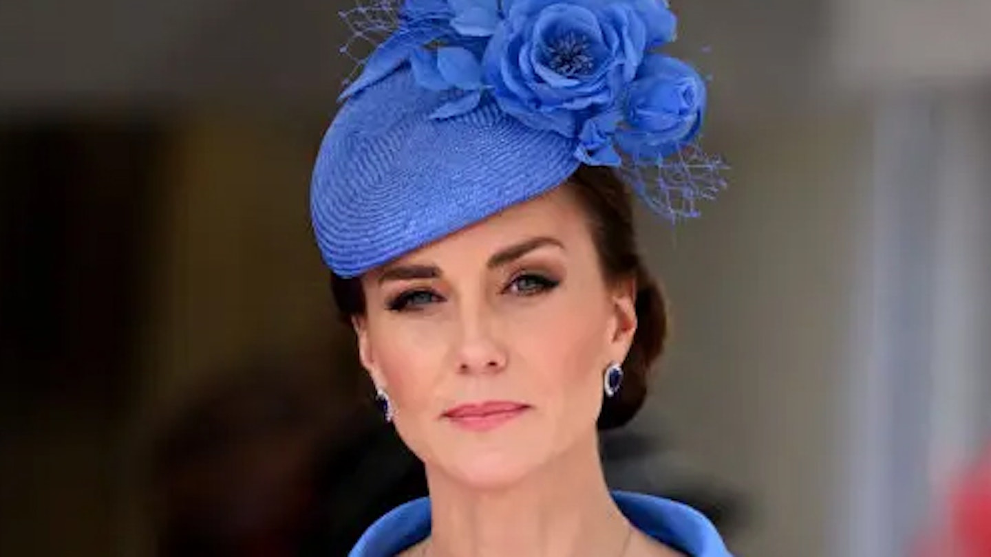 kate middleton in a blue hat looking stern