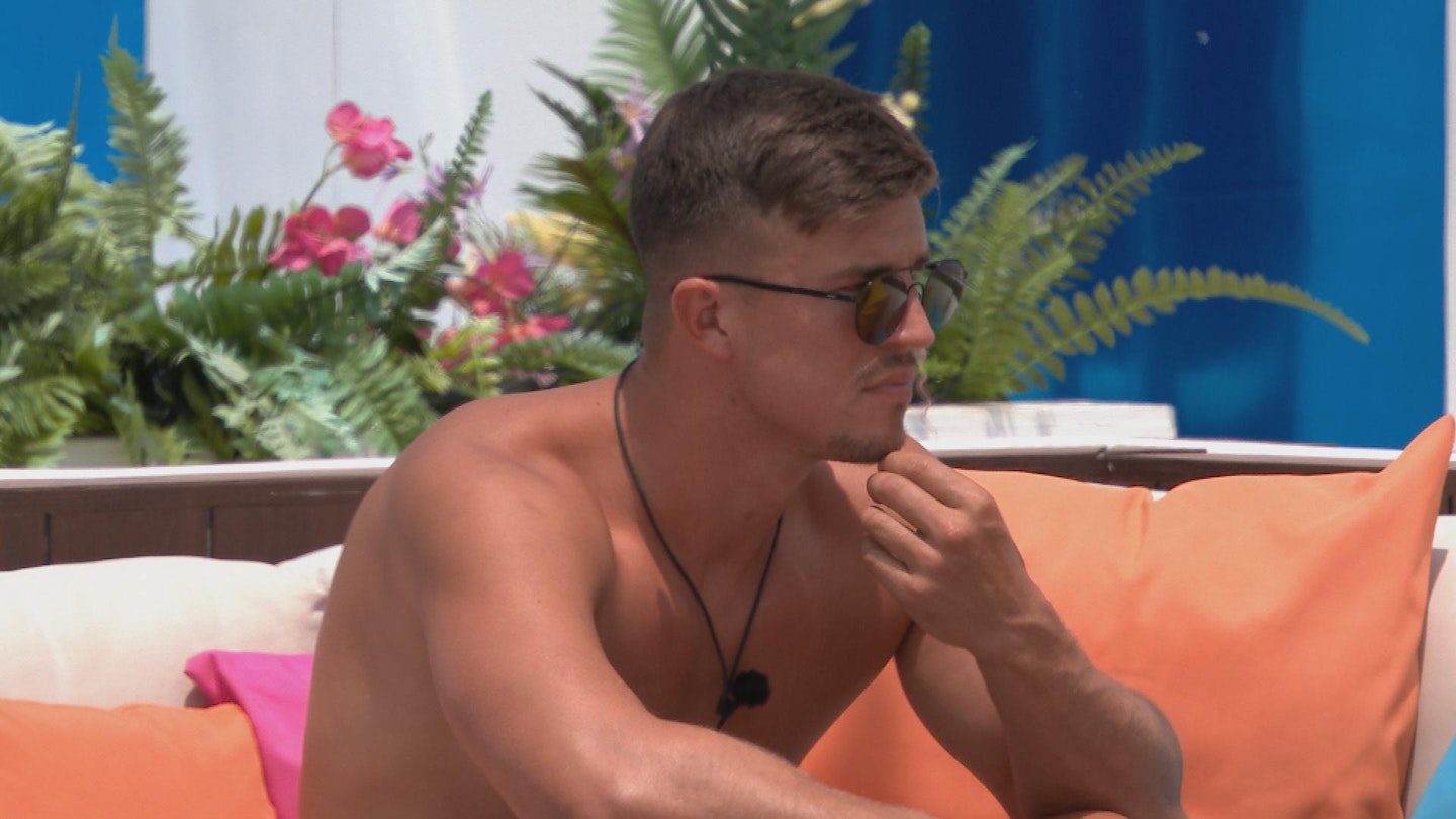Mitch Taylor wearing sunglasses outside shirtless