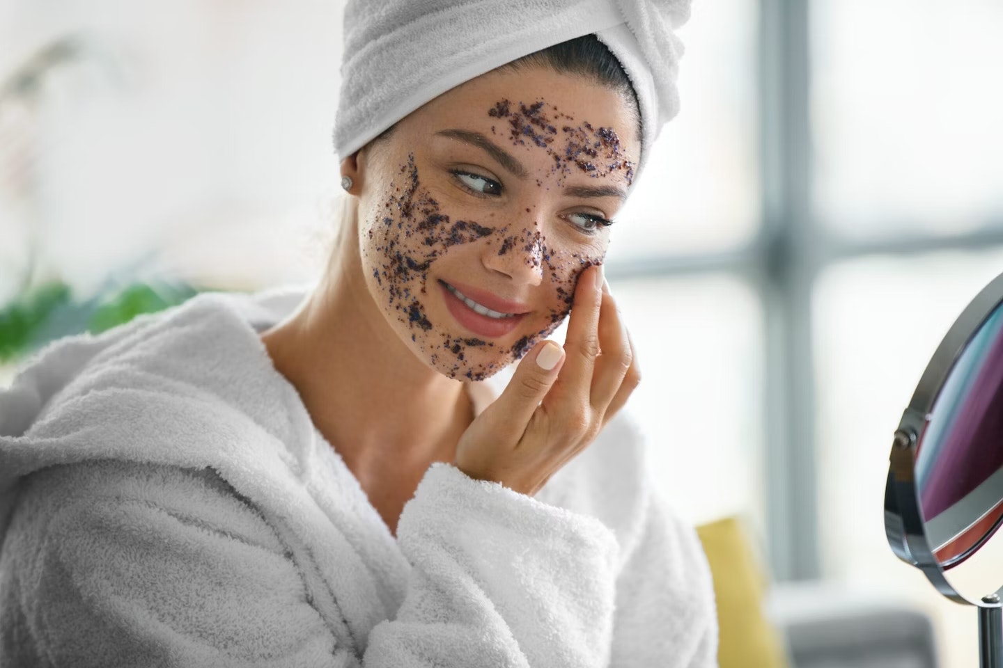 Woman doing face scrub