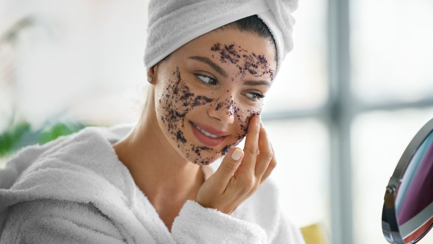 Woman doing face scrub