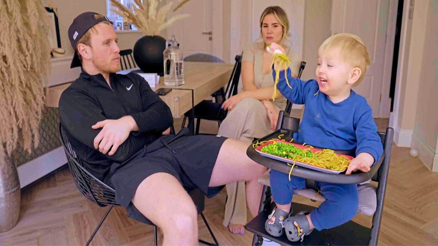 Tommy Mallet at home with his fiancee and baby, Brody