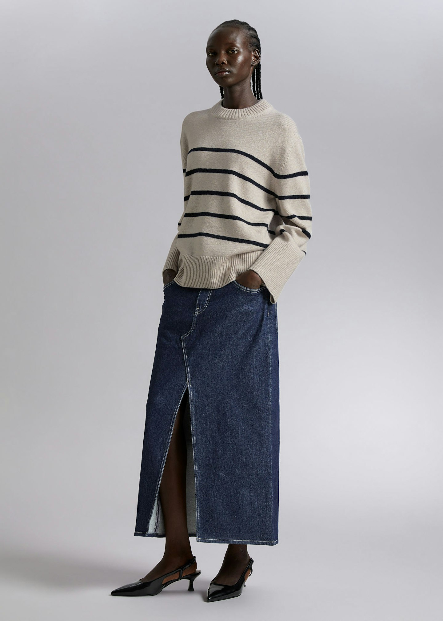 Woman wearing striped & other stories jumper