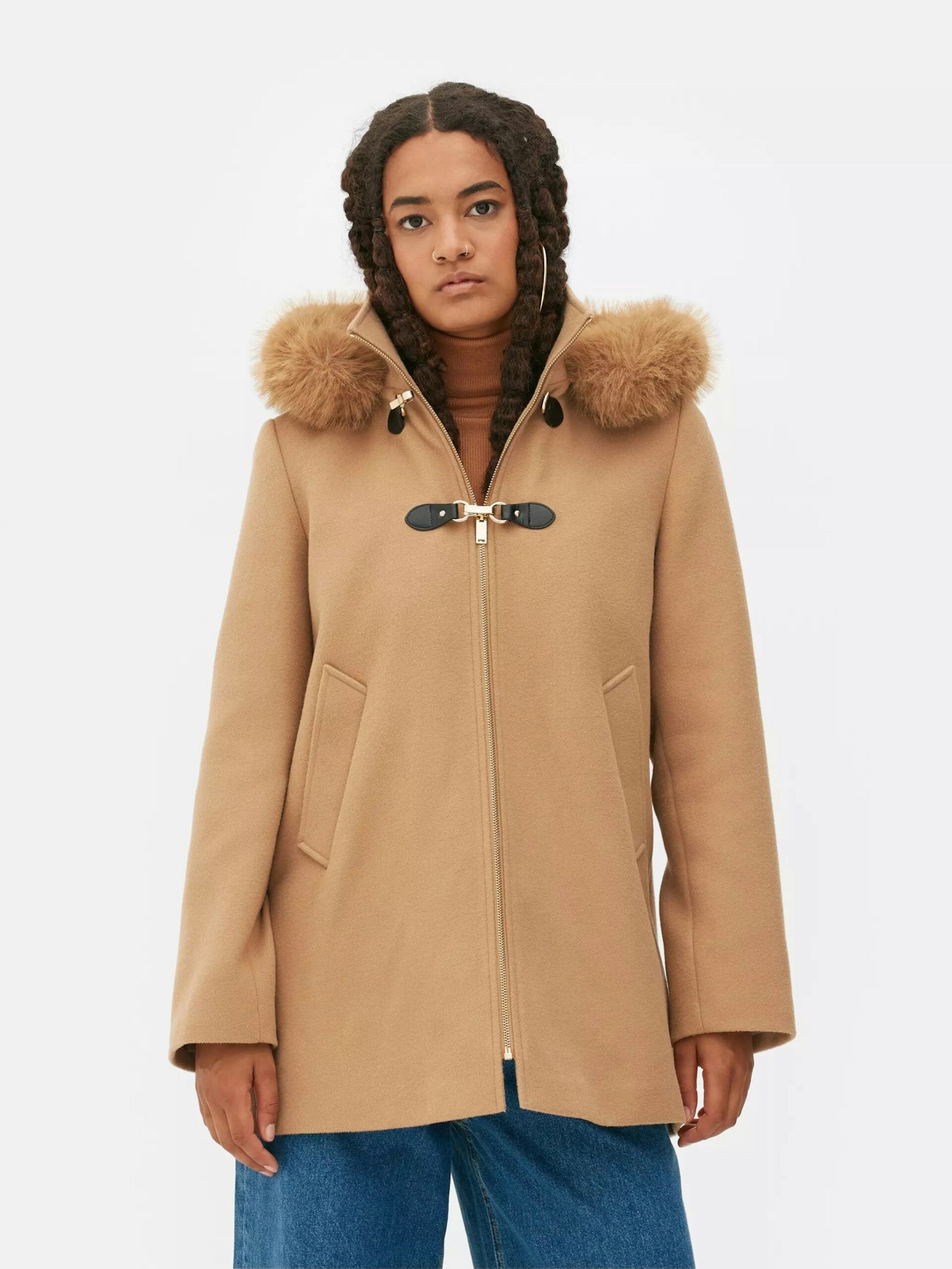 girl in camel coat 