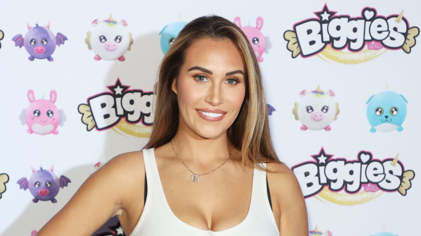 Chloe Goodman proudly shows off her new breast implants as she