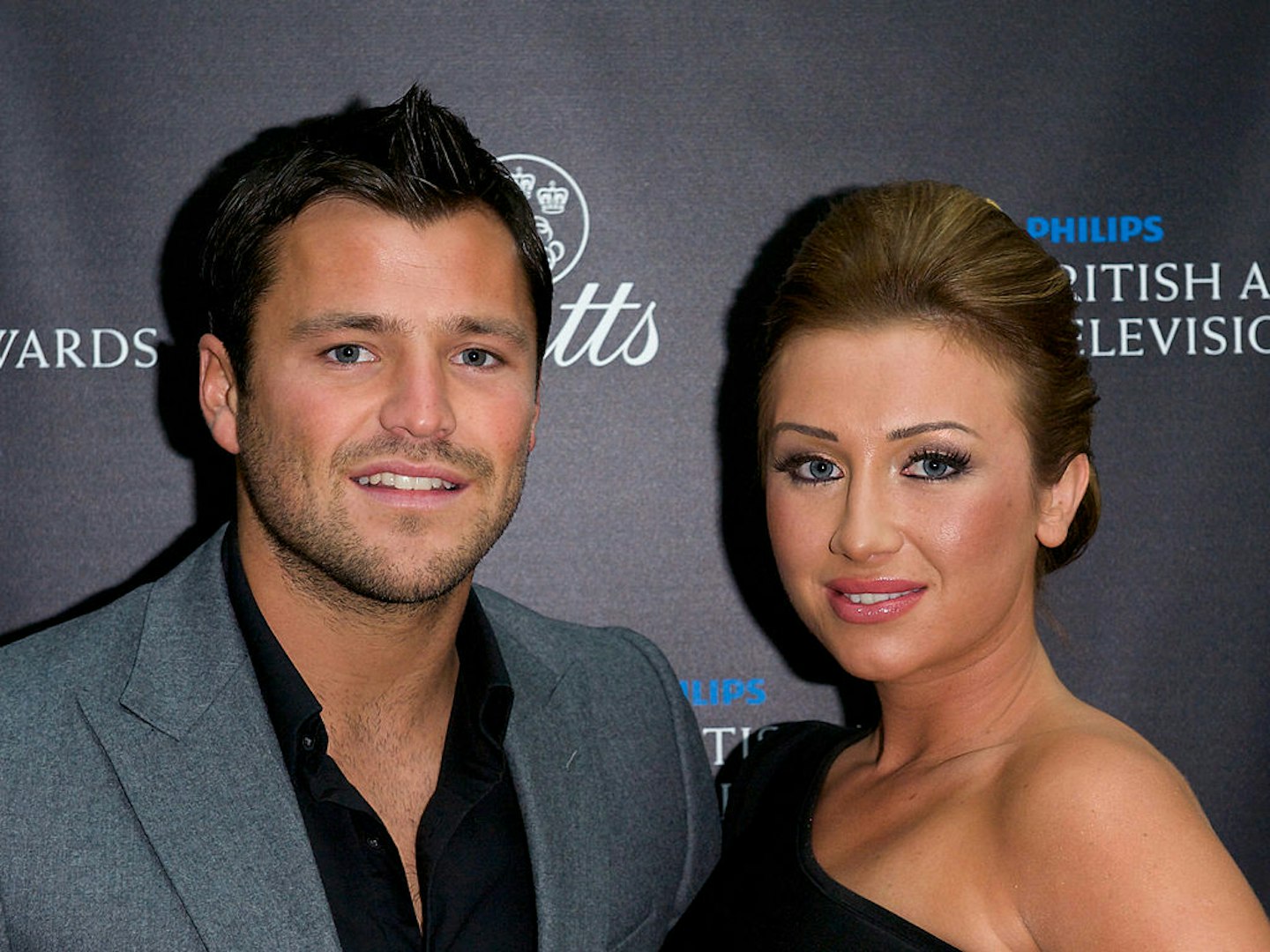 Mark Wright and Lauren Goodger pose on the red carpet in 2011