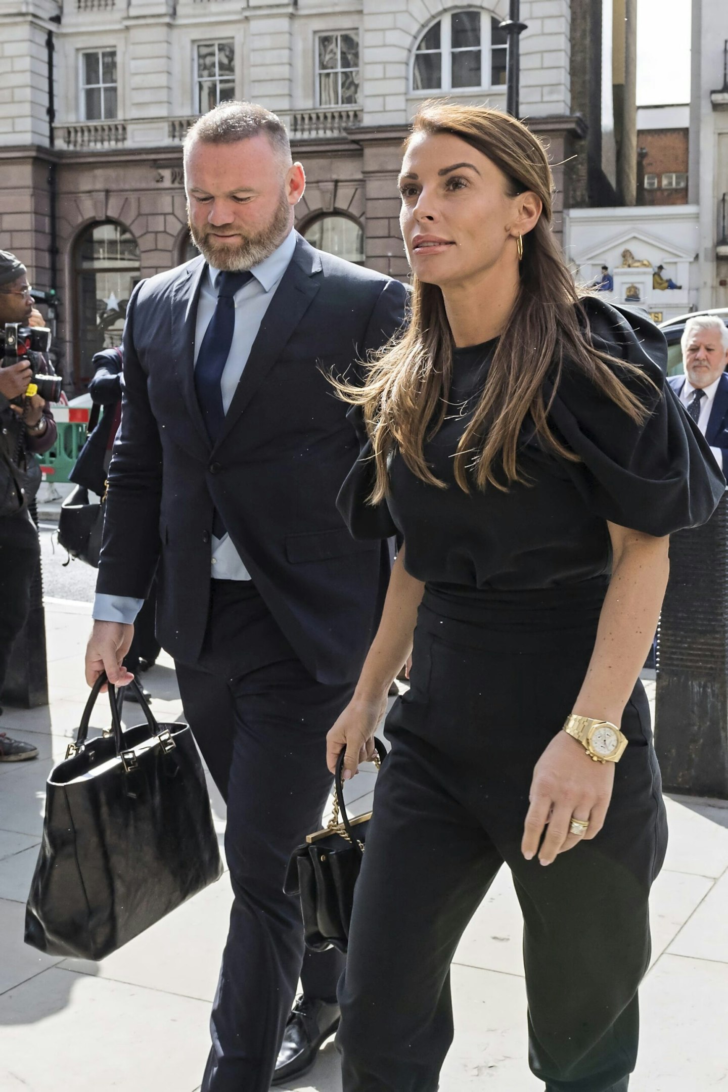 Coleen Rooney arrives at court with husband Wayne