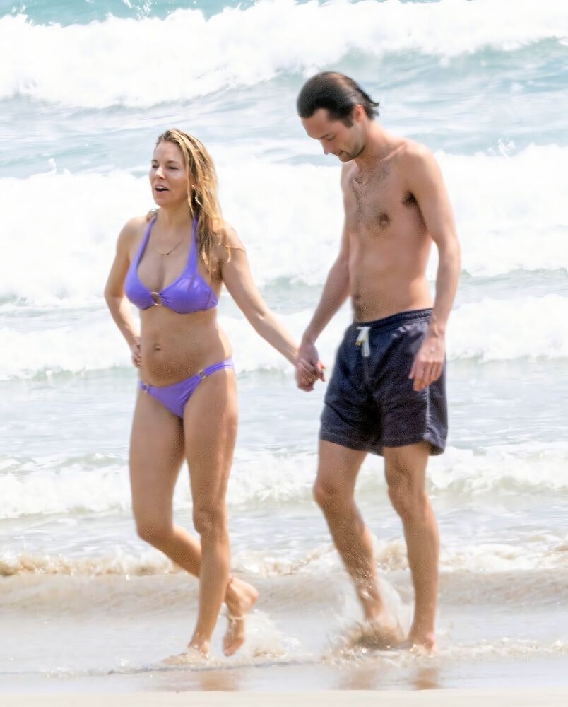 Sienna Miller and Oli Green on the beach in Costa Rica