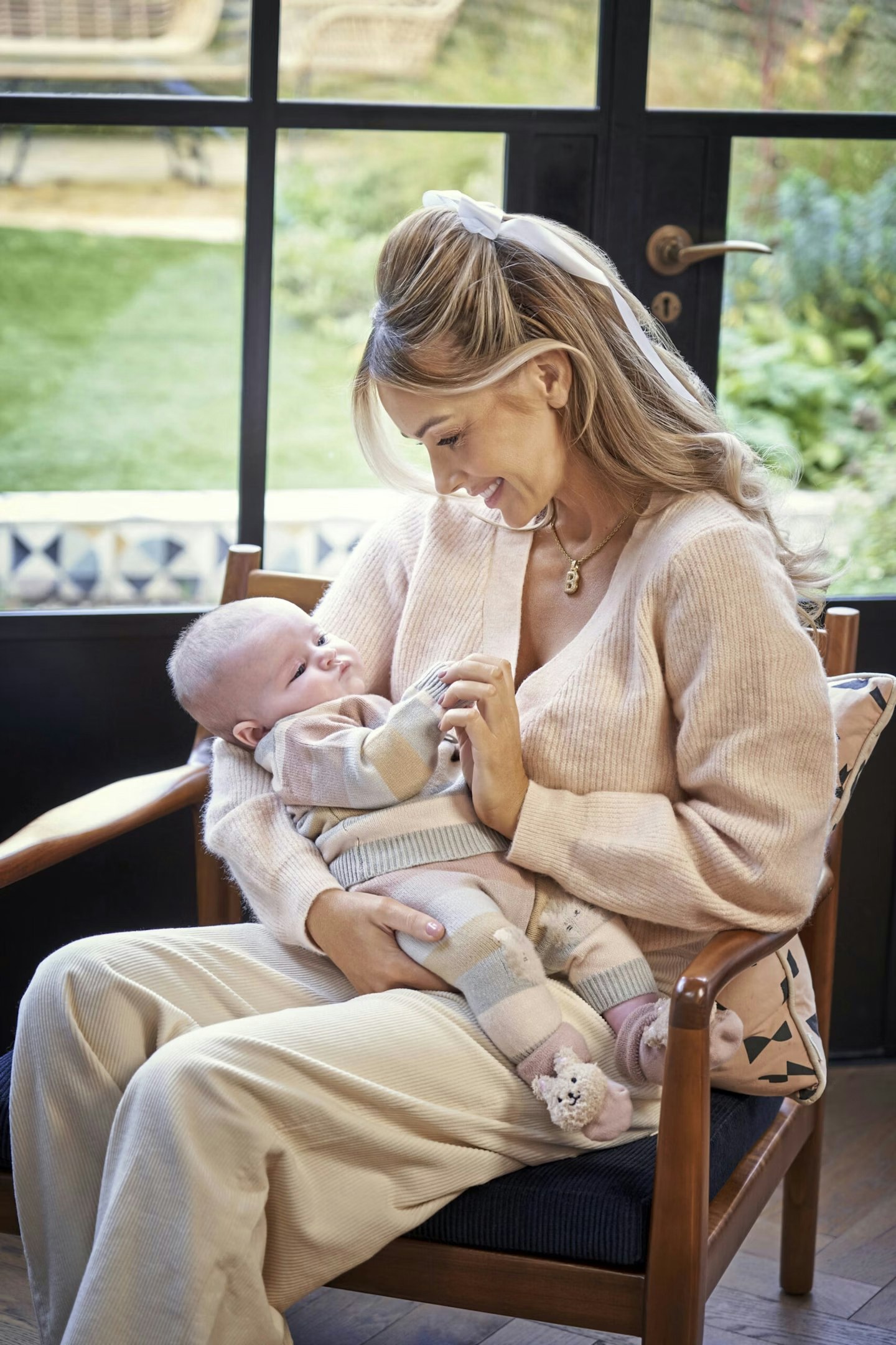 Laura Anderson looks at her baby