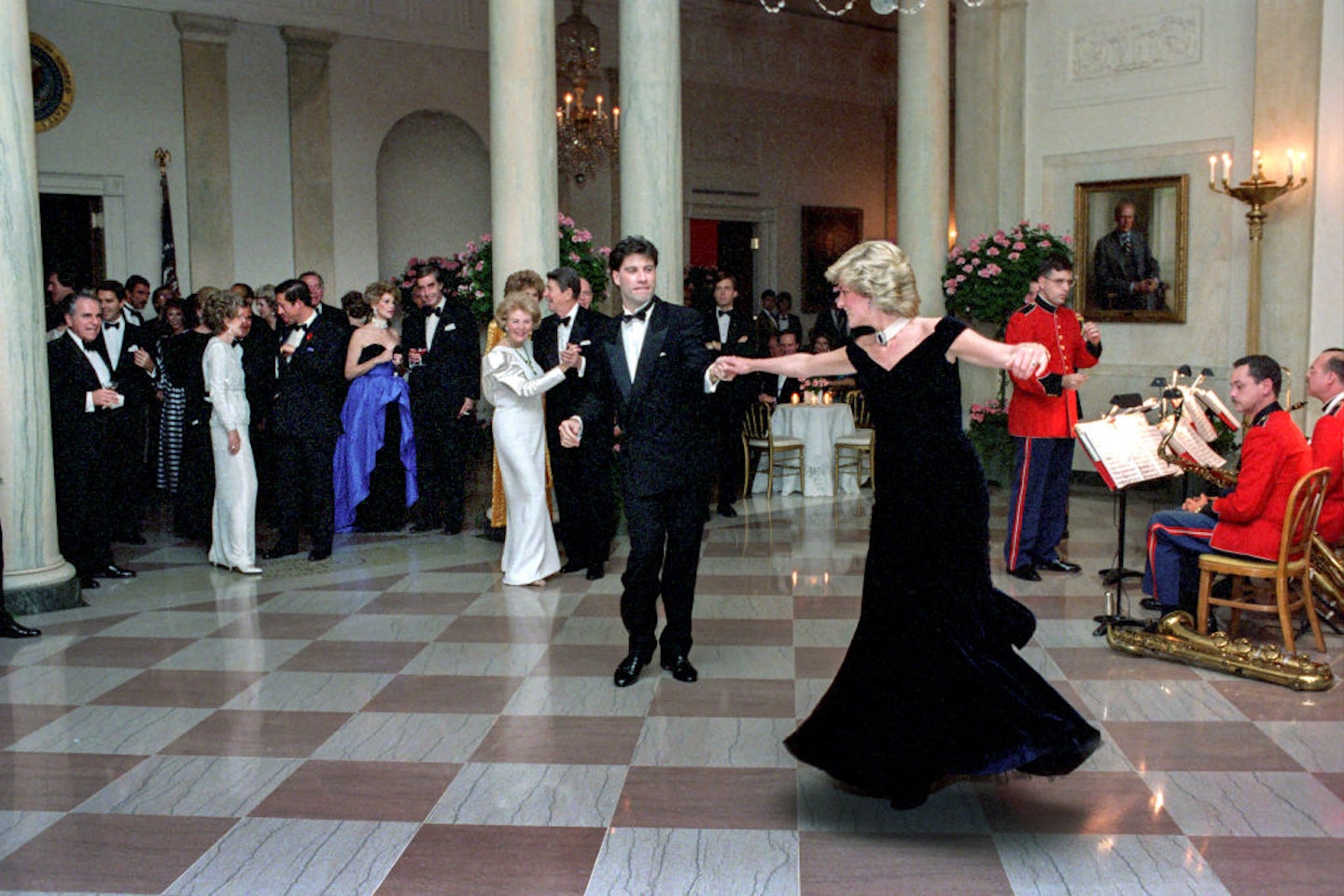 Princess Diana dancing with John Travolta in Cross Hall at the White House during an official dinner on November 9, 1985 in Washington, DC