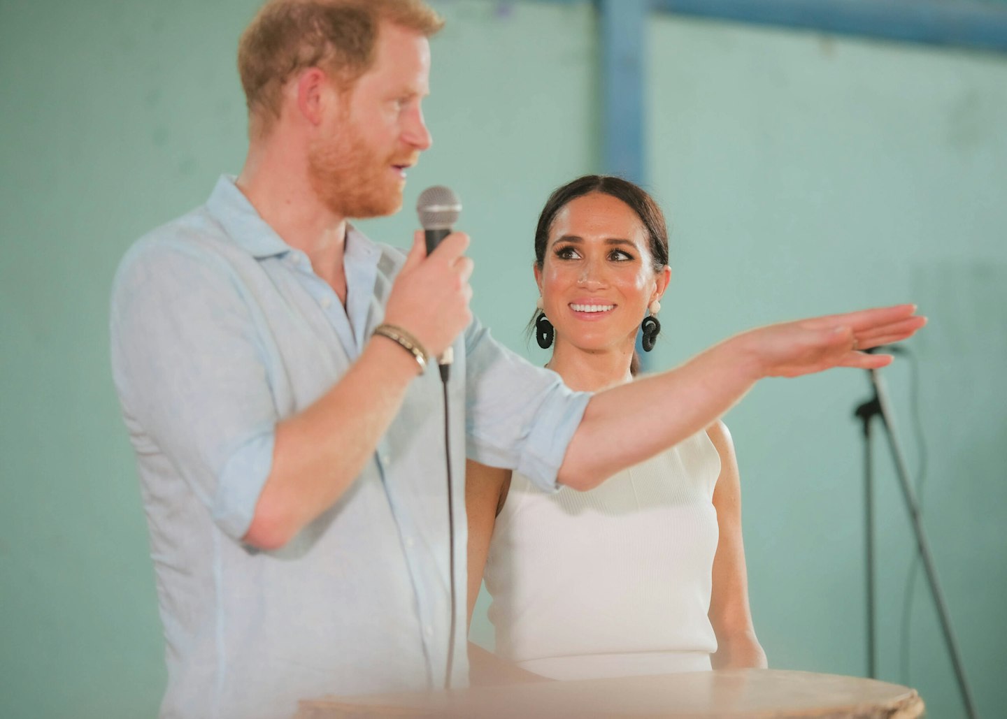 PRINCE HARRY, Duke of Sussex speaking and MEGHAN, Duchess of Sussex during their official visit to San Bacilio de Palenque, Colombia