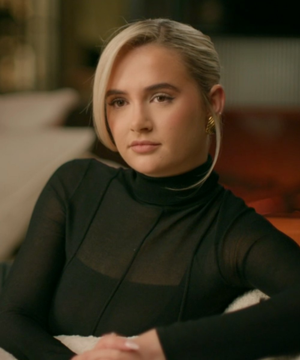 molly-mae wearing a black mesh top and gold earrings