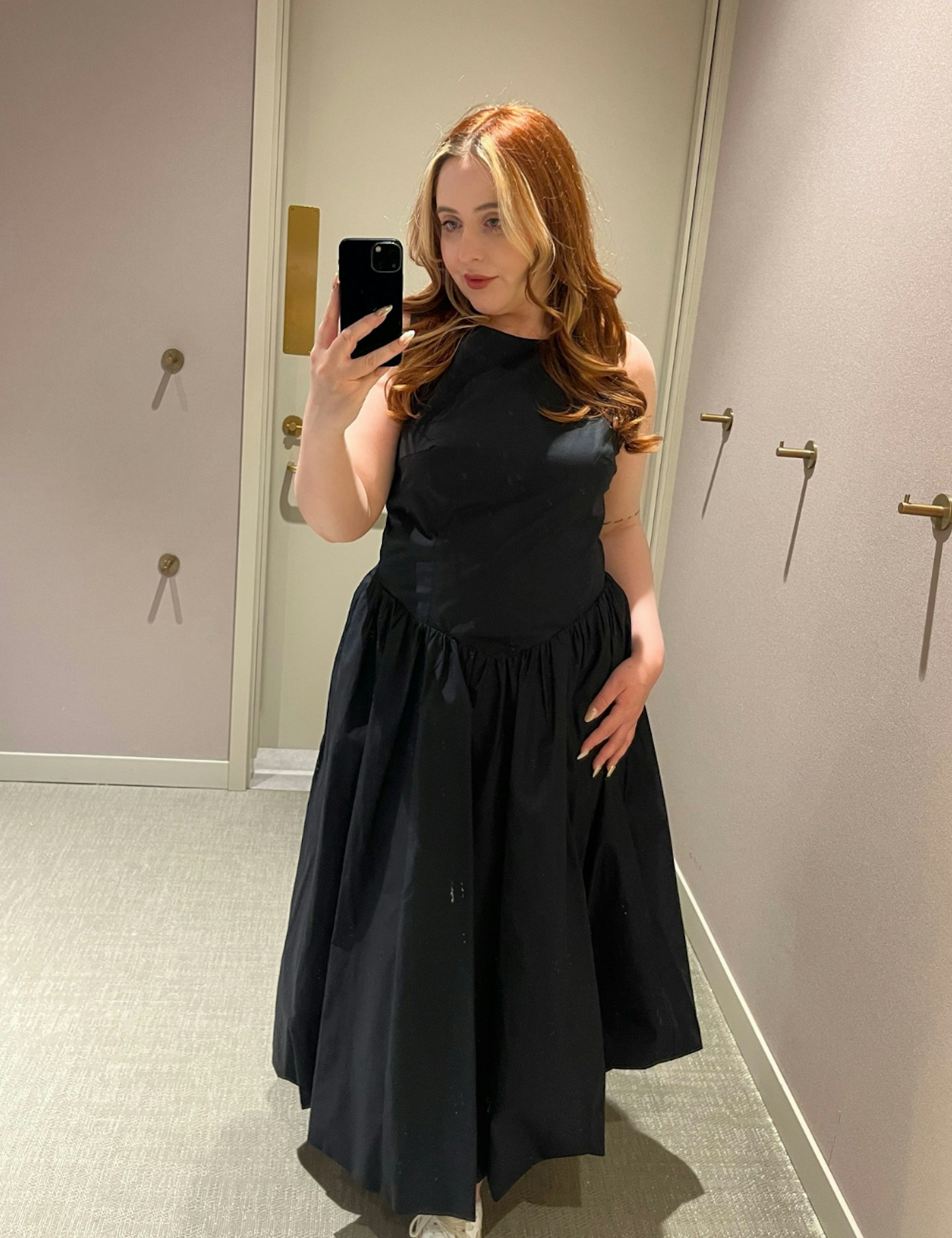 sam price wears M&S black bubble hem dress