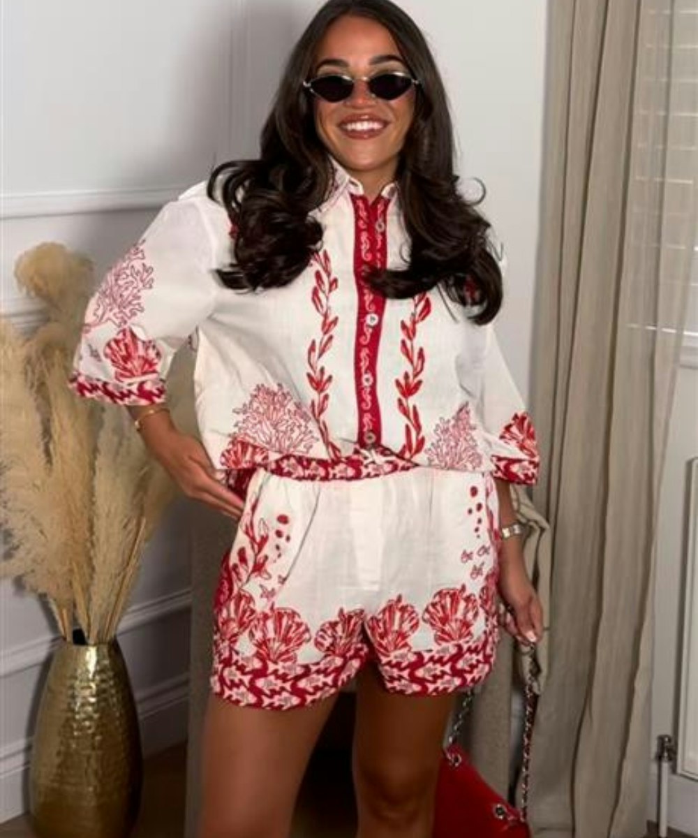 influencer wearing red and white shell print co-ord from River Island