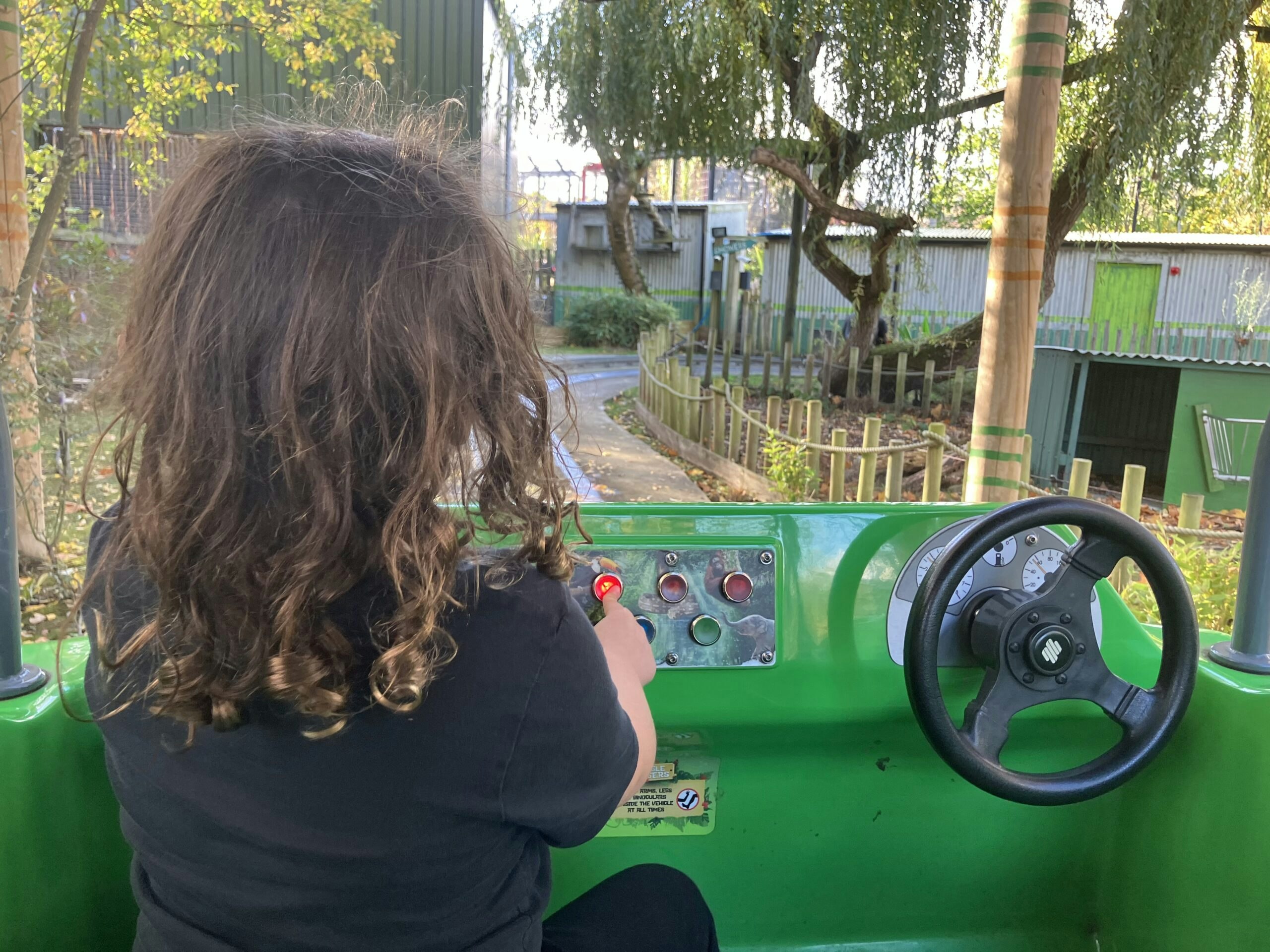 back view of a little girl on the jungle safari ride at chessington world of adventures