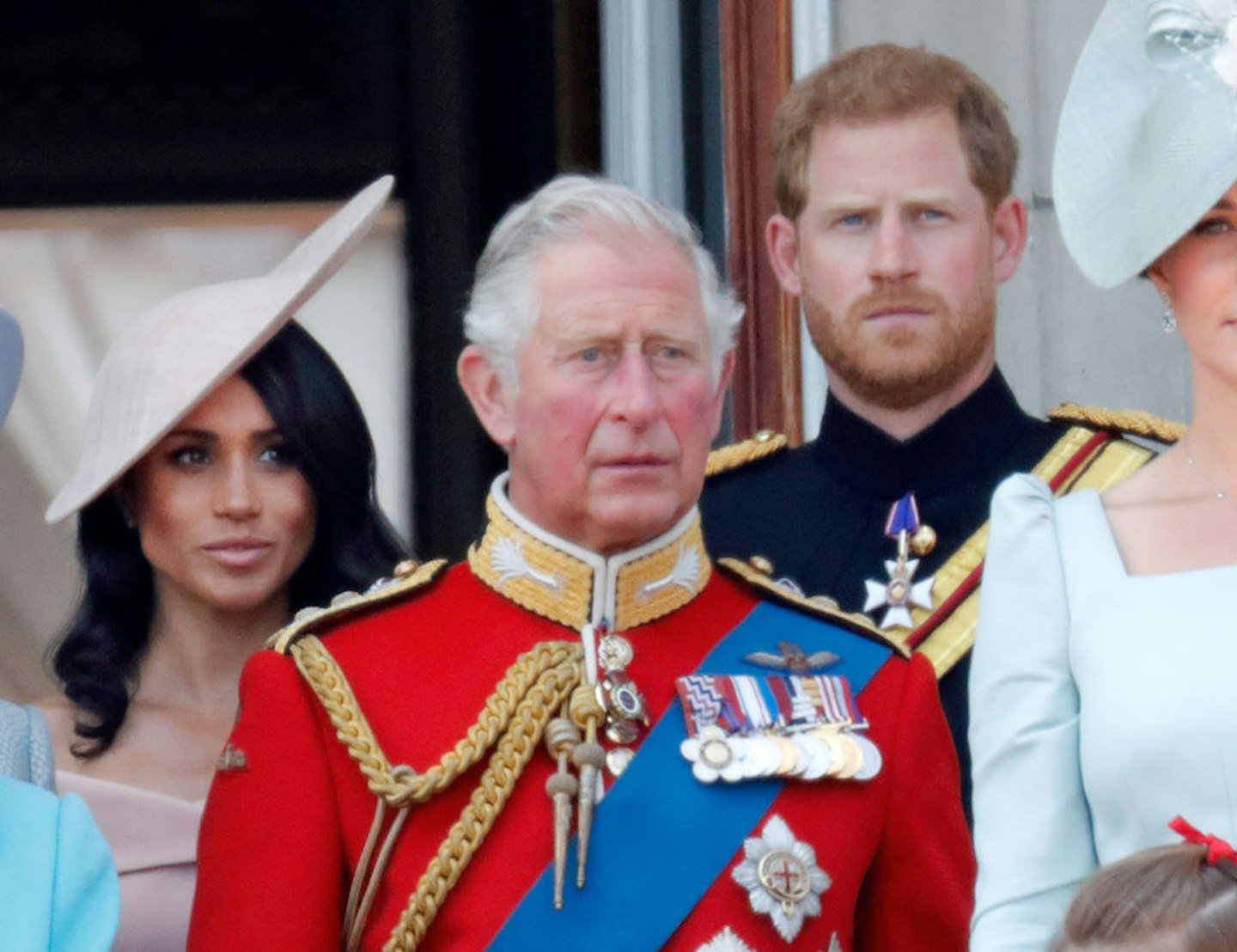 Meghan, Duchess of Sussex, Prince Charles, Prince of Wales and Prince Harry, Duke of Sussex stand on the balcony of Buckingham Palace during Trooping The Colour 2018
