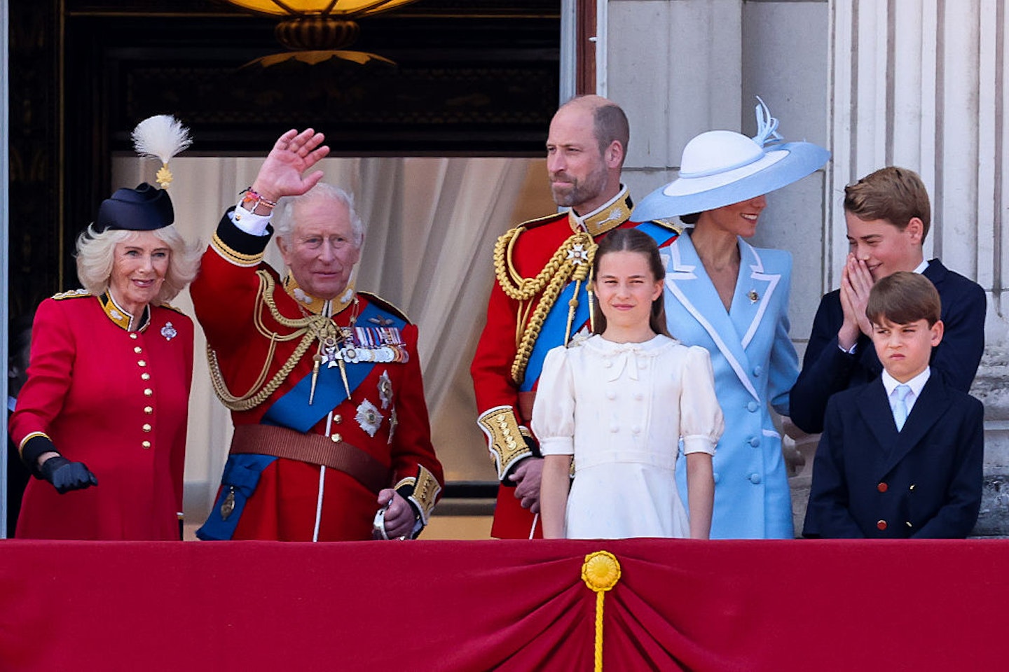 Queen Camilla, King Charles III, Prince William, Catherine, Princess of Wales, Princess Charlotte of Wales, Prince Louis of Wales and Prince George of Wales stand on the balcony of Buckingham Palace after attending Trooping the Colour 2026