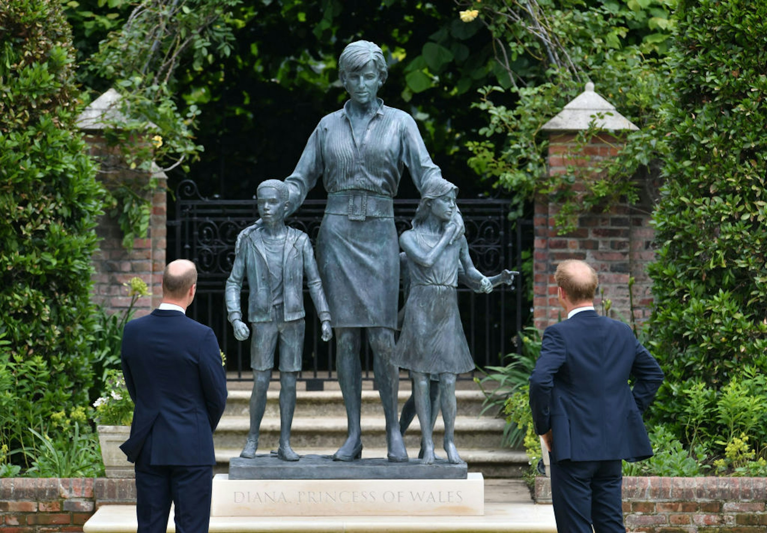 Prince William, Duke of Cambridge (left) and Prince Harry, Duke of Sussex after they unveiled a statue they commissioned of their mother Diana, Princess of Wales, in the Sunken Garden at Kensington Palace, on what would have been her 60th birthday