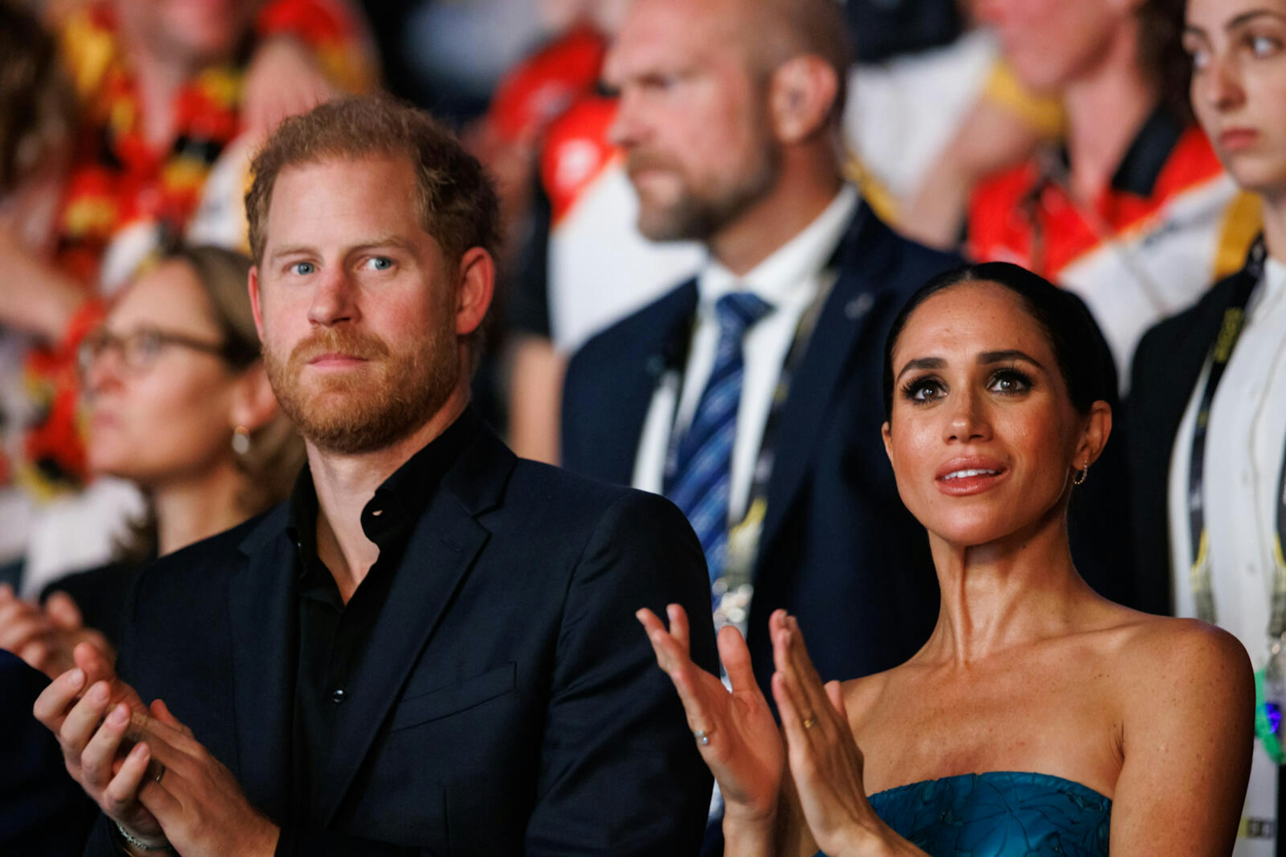 Harry and Meghan giving a round of applause