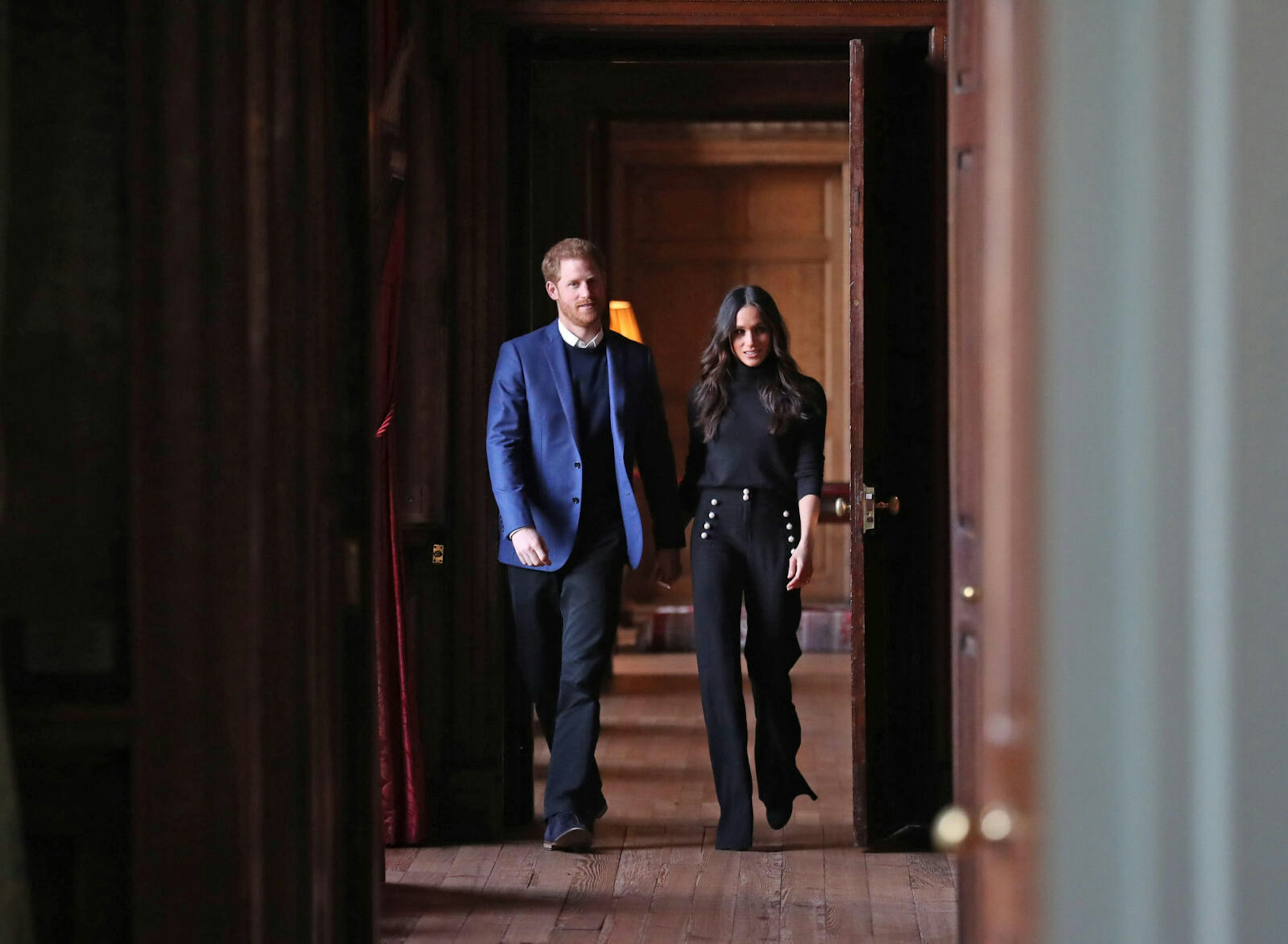 Harry and Meghan striding with purpose