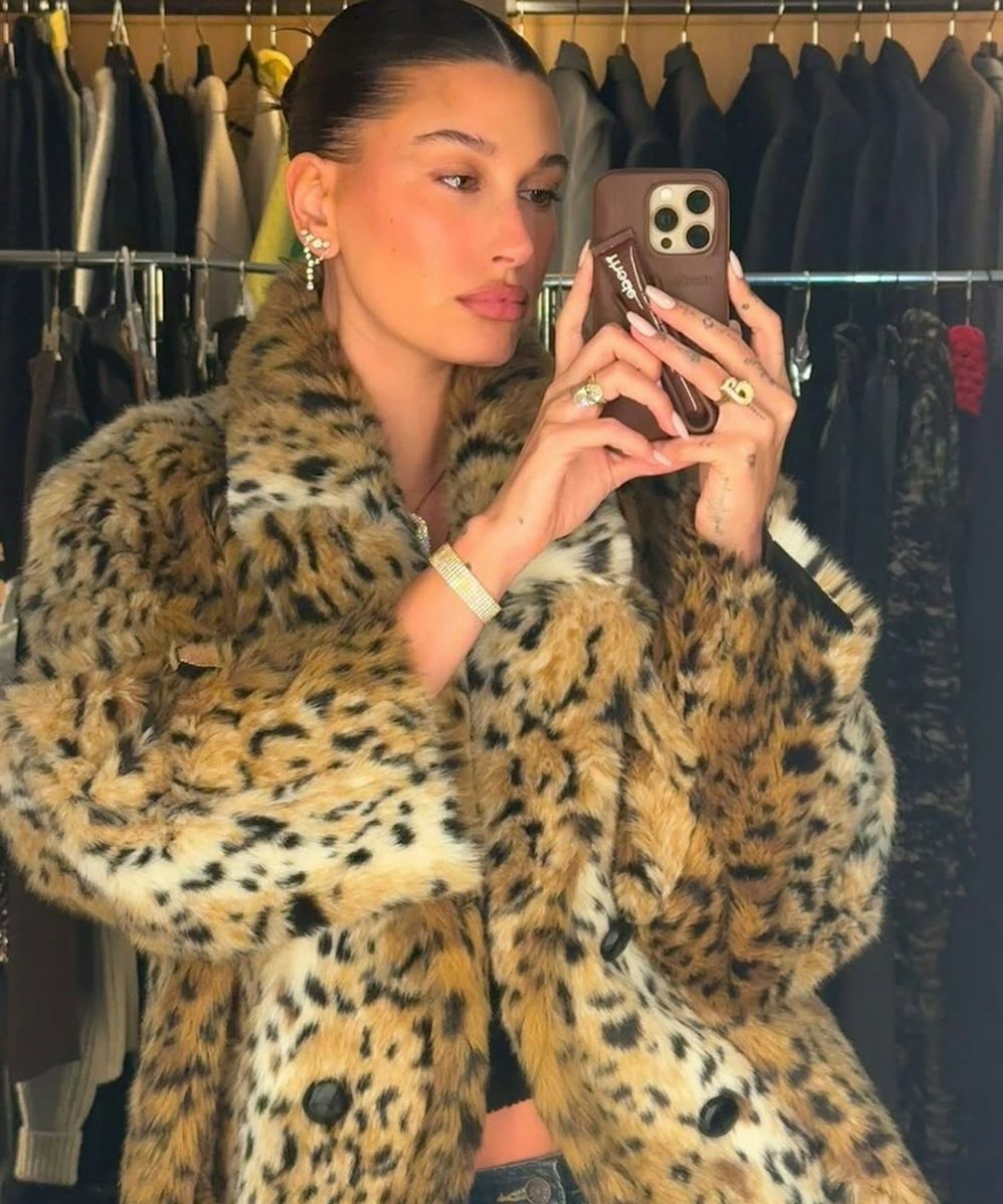 Hailey Bieber wearing a white faux fur coat