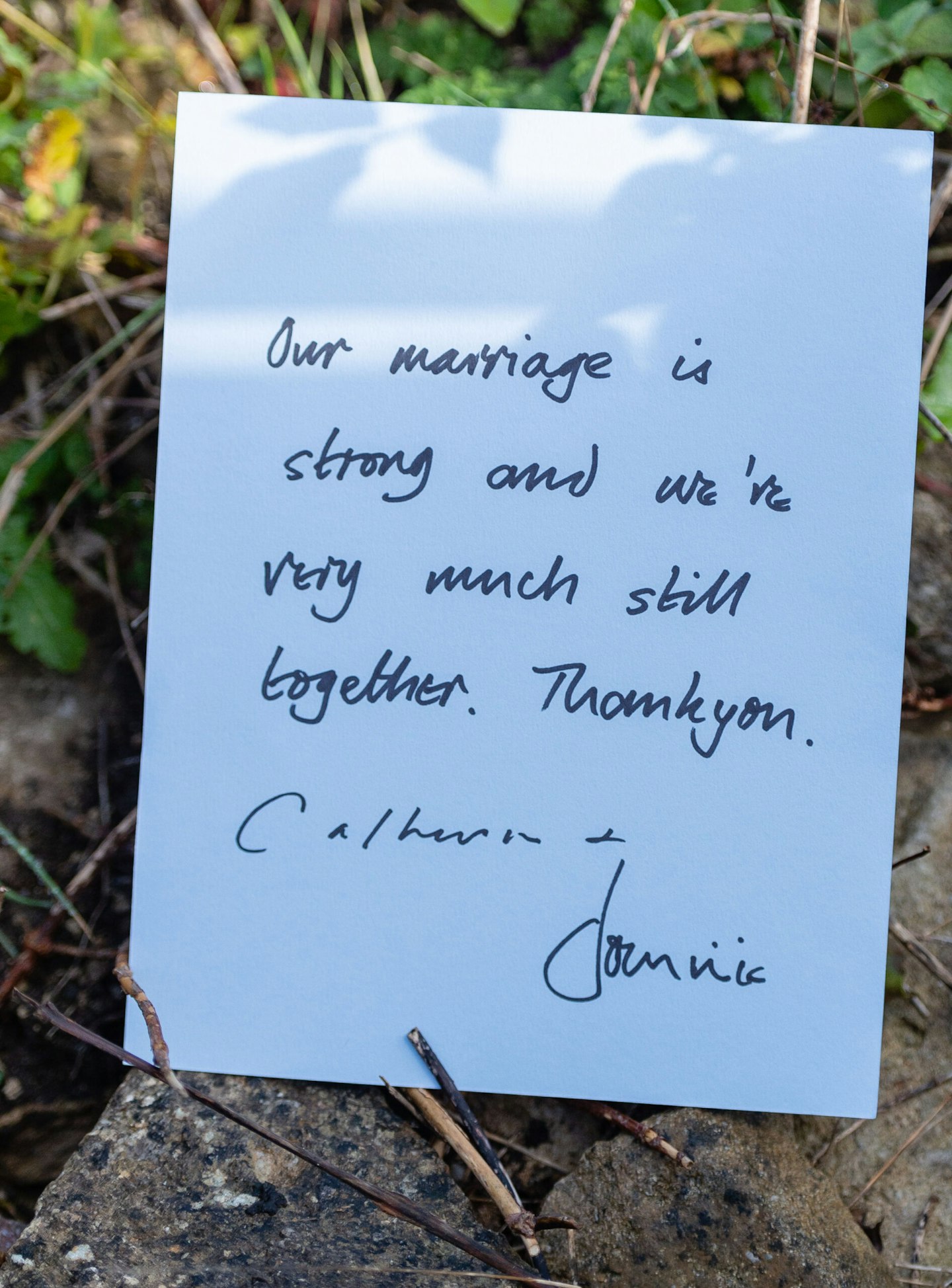 Dominic West and wife Catherine FitzGerald make a statement to press outside their Cotswolds home after Dominic was seen kissing actress Lily James whilst in Rome. The note reads 'Our marriage is strong and we're very much still together. Thank you. Catherine + Dominic