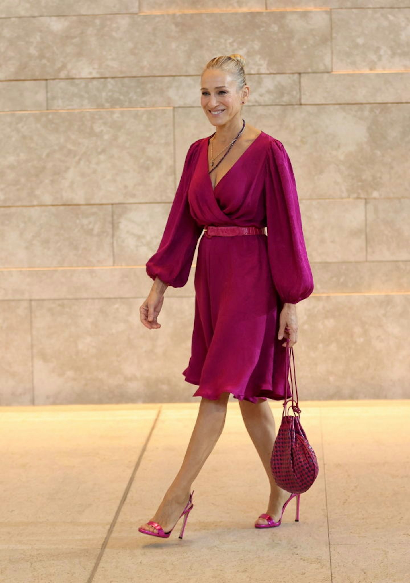 https://images.bauerhosting.com/celebrity/sites/3/2022/11/and-just-like-that-sarah-jessica-parker-pink-dress.jpg?auto=format&w=1440&q=80