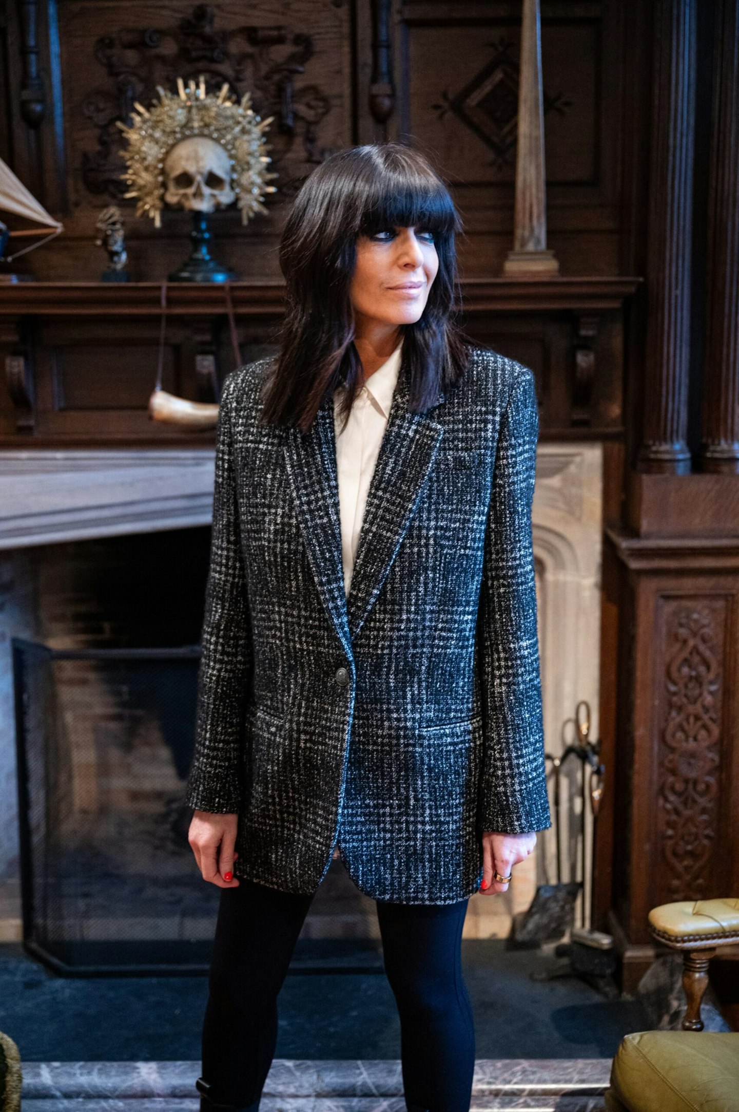 claudia winkleman wearing a tweed blazer in the traitors season 3