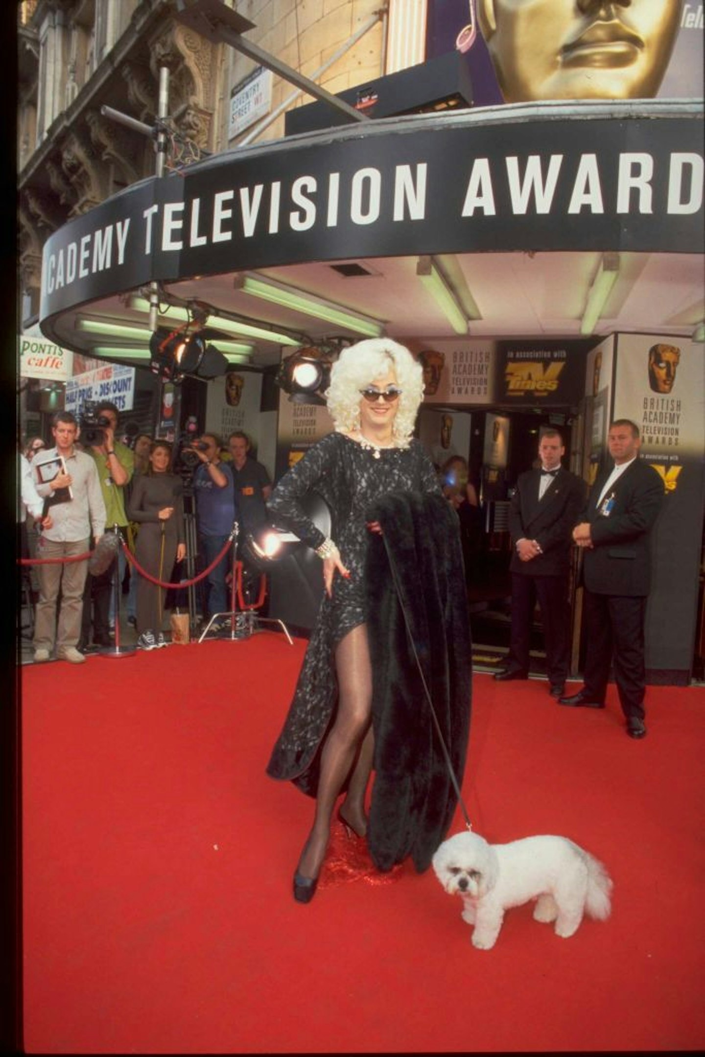Lily posing on red carpet with dog