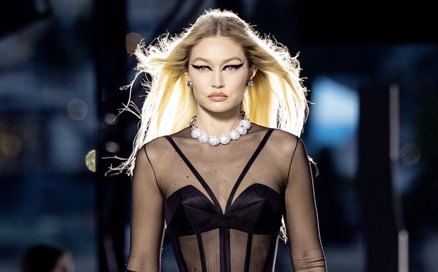 Gigi Hadid returns to the Versace catwalk in a crop top, six
