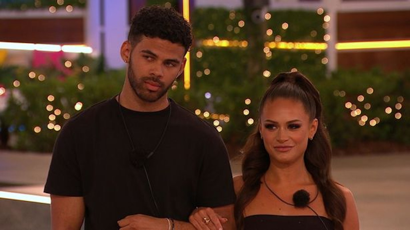 olivia and Maxwell arm in arm during a recoupling in the villa